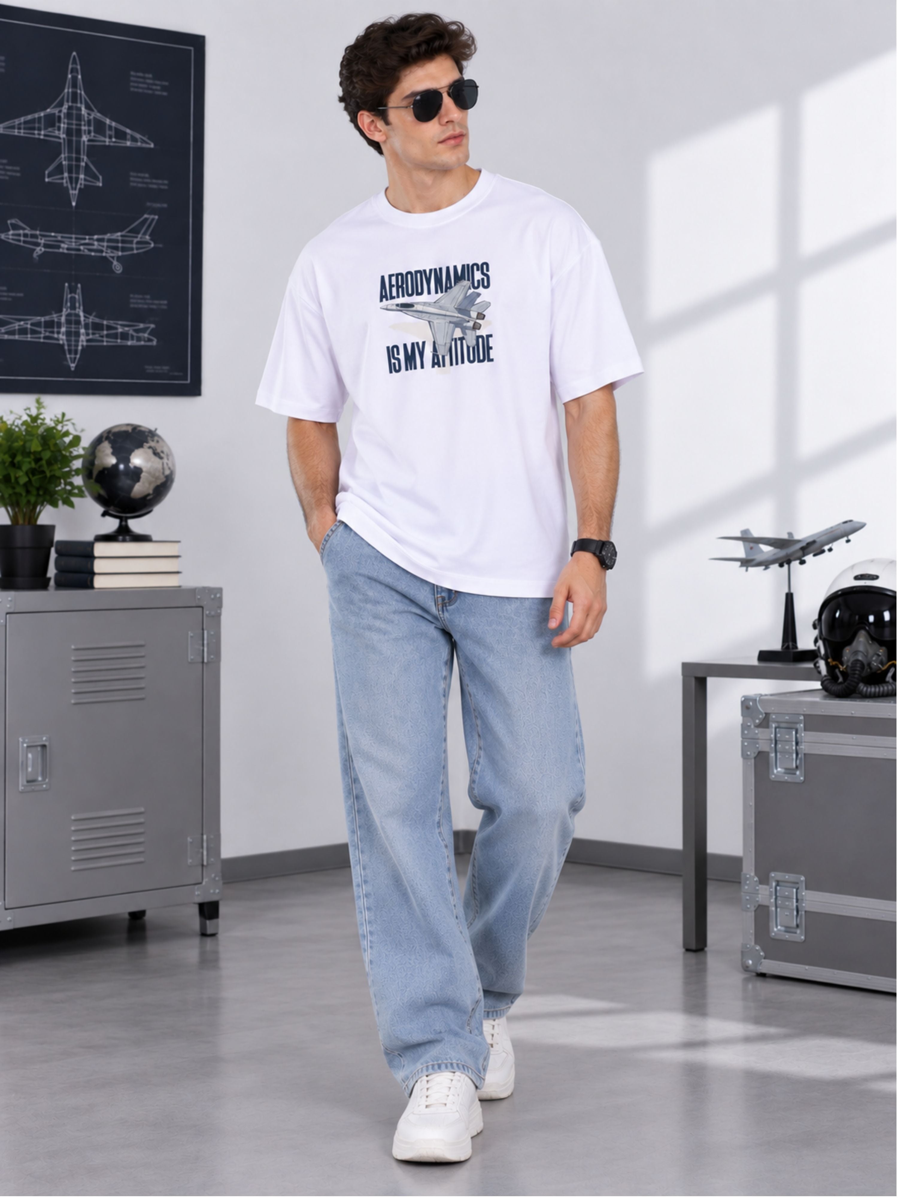 Man wearing oversized fit Aeronautical Engineer Quote T Shirt for Men in white with casual jeans
