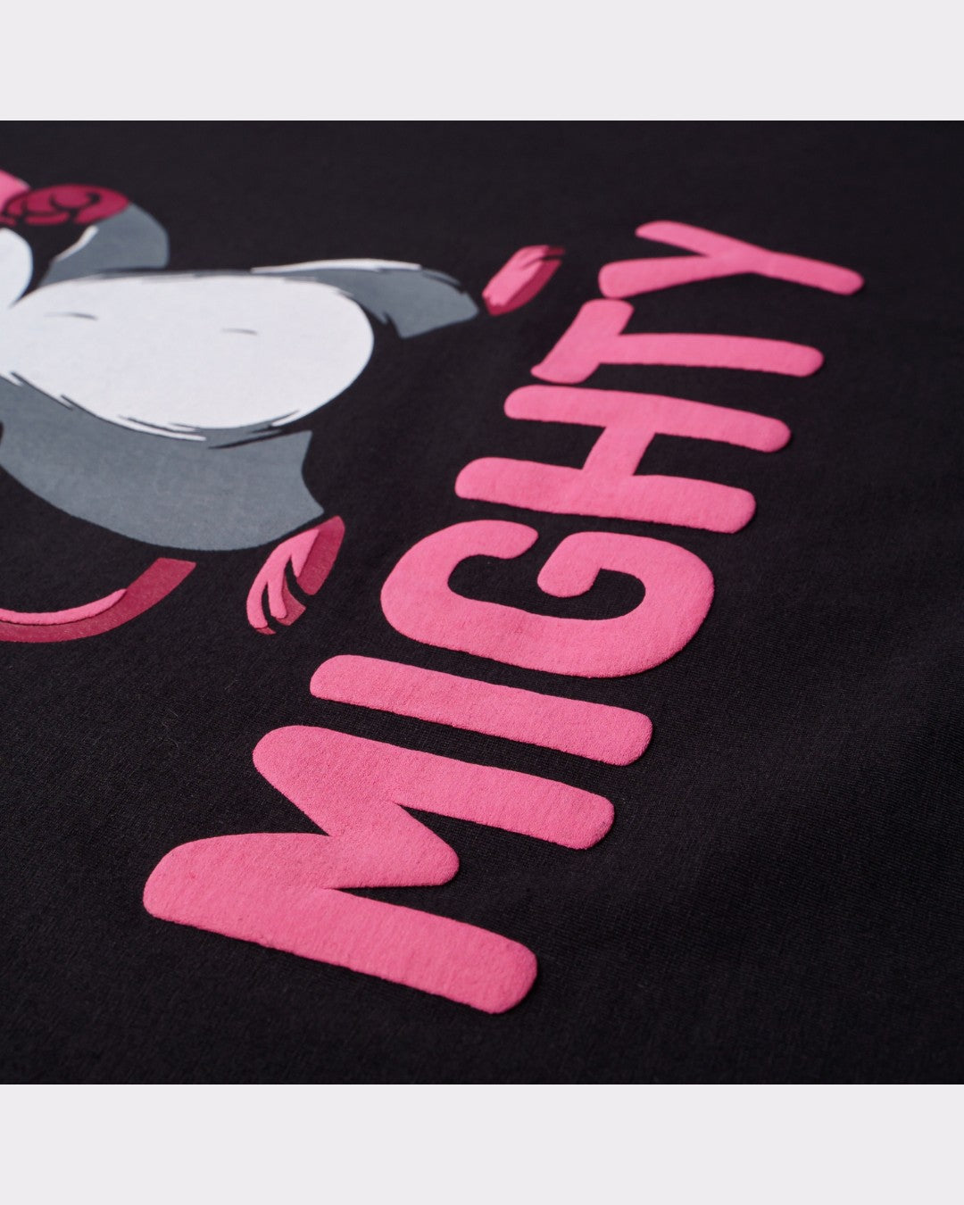 Close-up of Animal Archetype Oversized T-Shirt For Men with pink mighty text and graphic design on black fabric