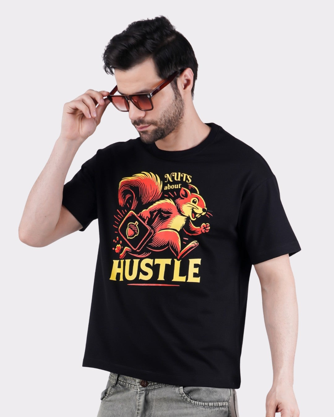 Animal Printed Oversized T-Shirt for Men in black with colorful squirrel graphic and hustle slogan by Bandar Baant Collections