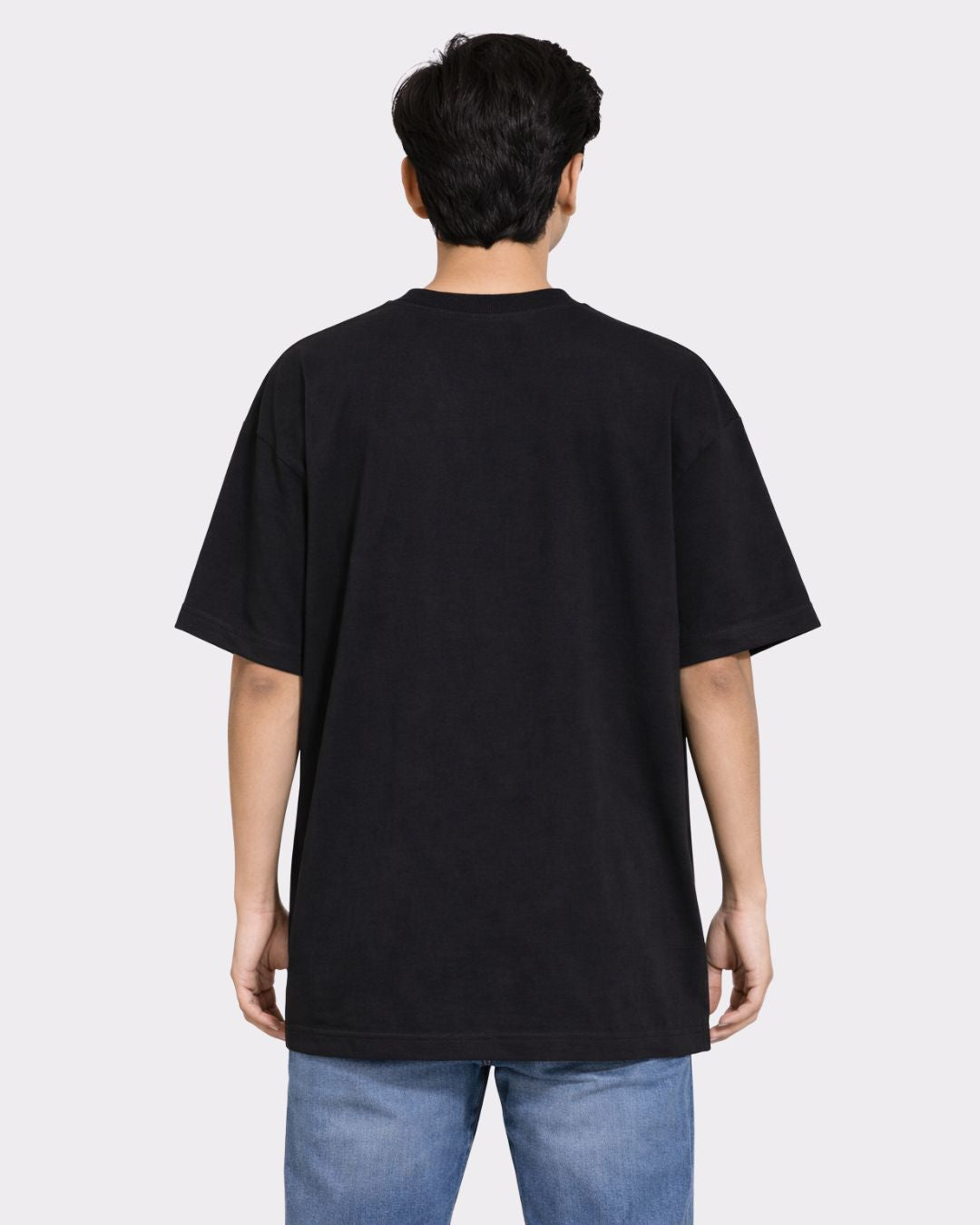 Back view of a man wearing a black Lawyer Oversized Funky T-Shirt For Men from Bandar Baant Collections