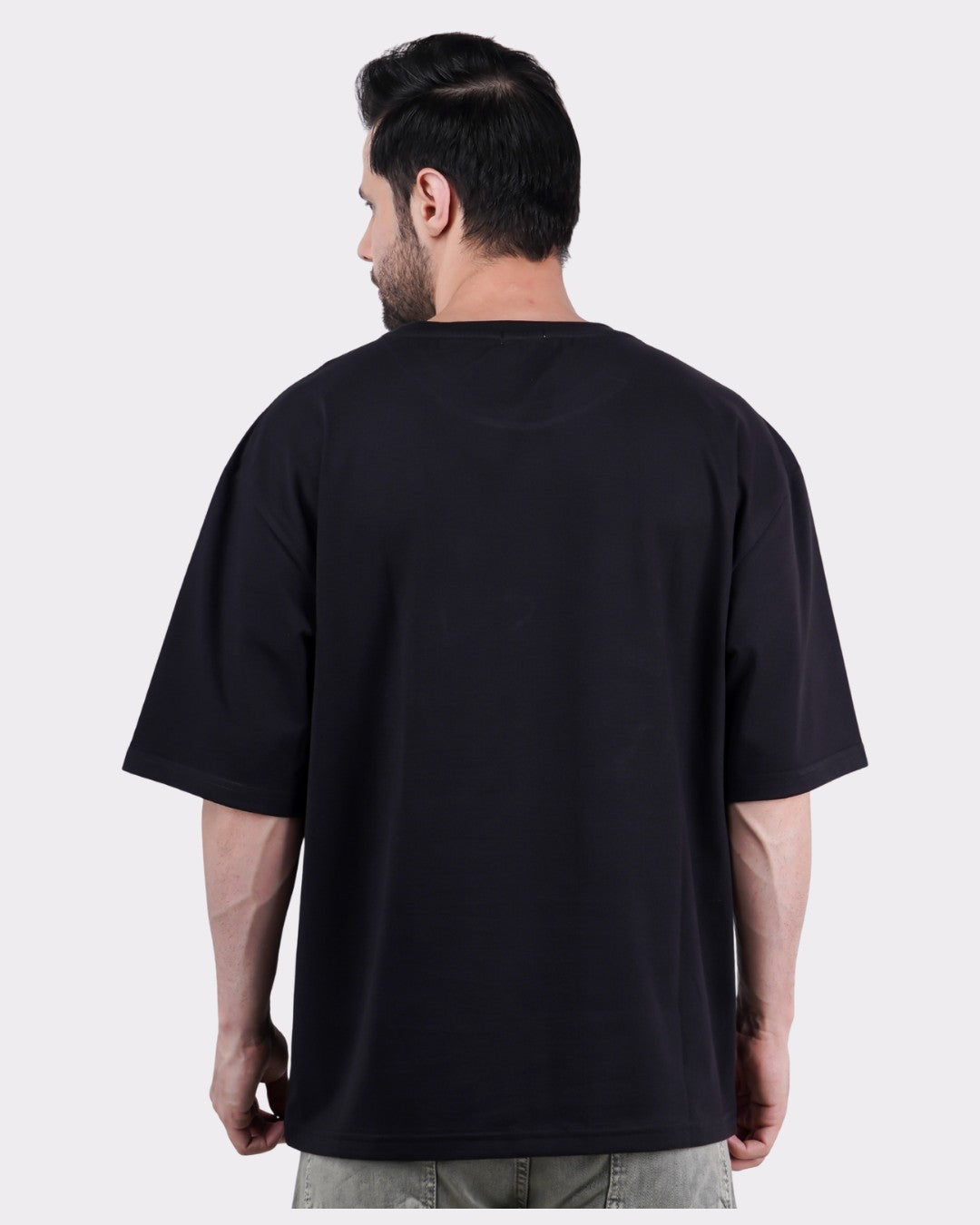 Back view of a man wearing Multitasking Since Forever | Octopus Animal Archetype Oversized T-Shirt For Men in black
