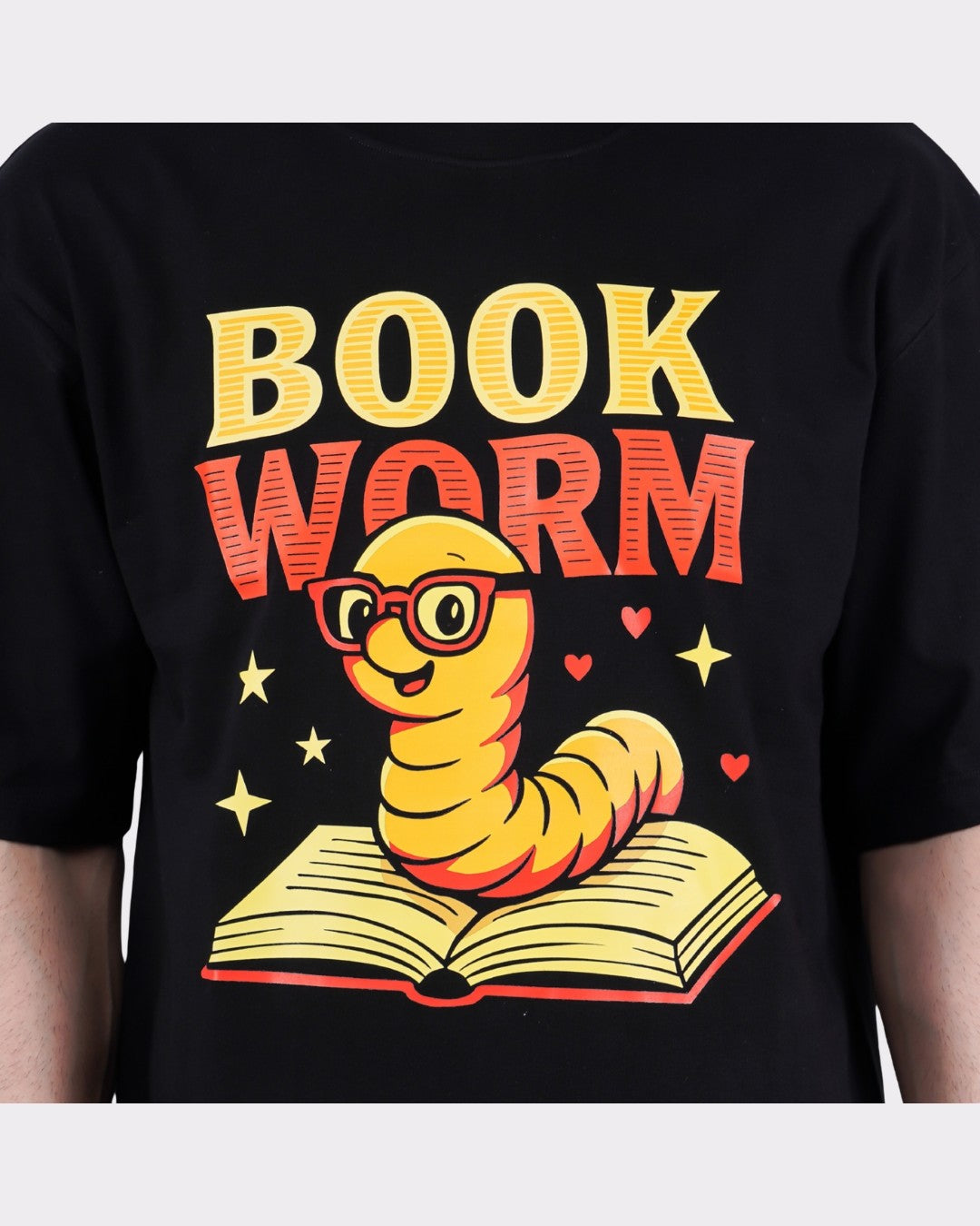 Black Book Worm Oversized T-Shirt For Men with a cute cartoon worm wearing glasses on an open book