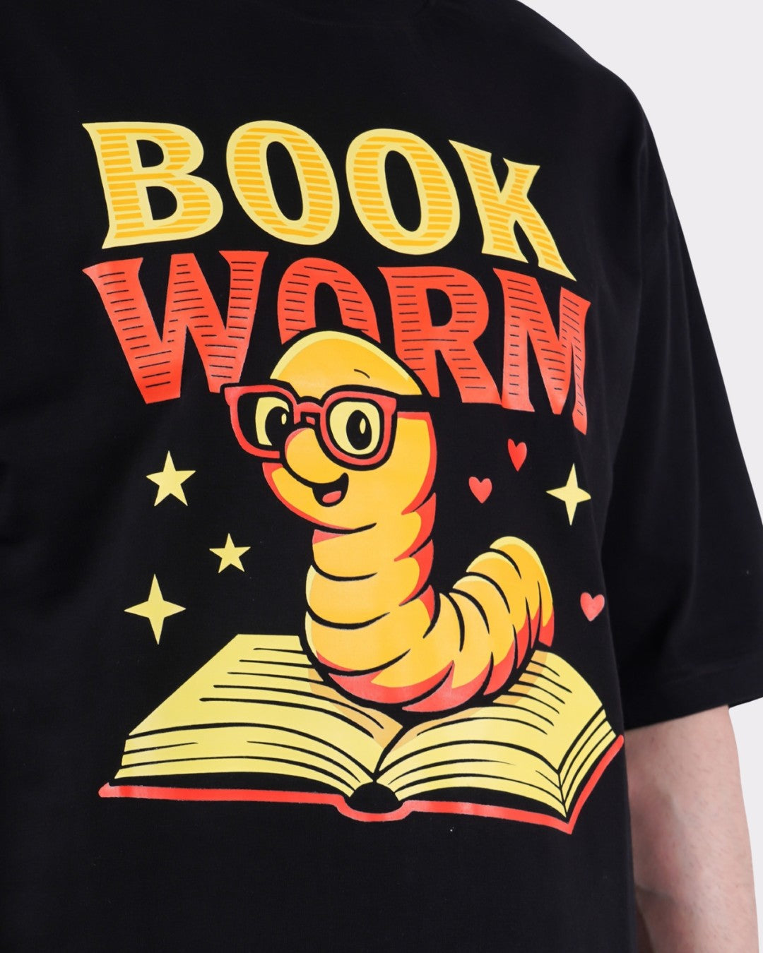 Black Book Worm Oversized T-Shirt For Men with cartoon bookworm graphic and open book design
