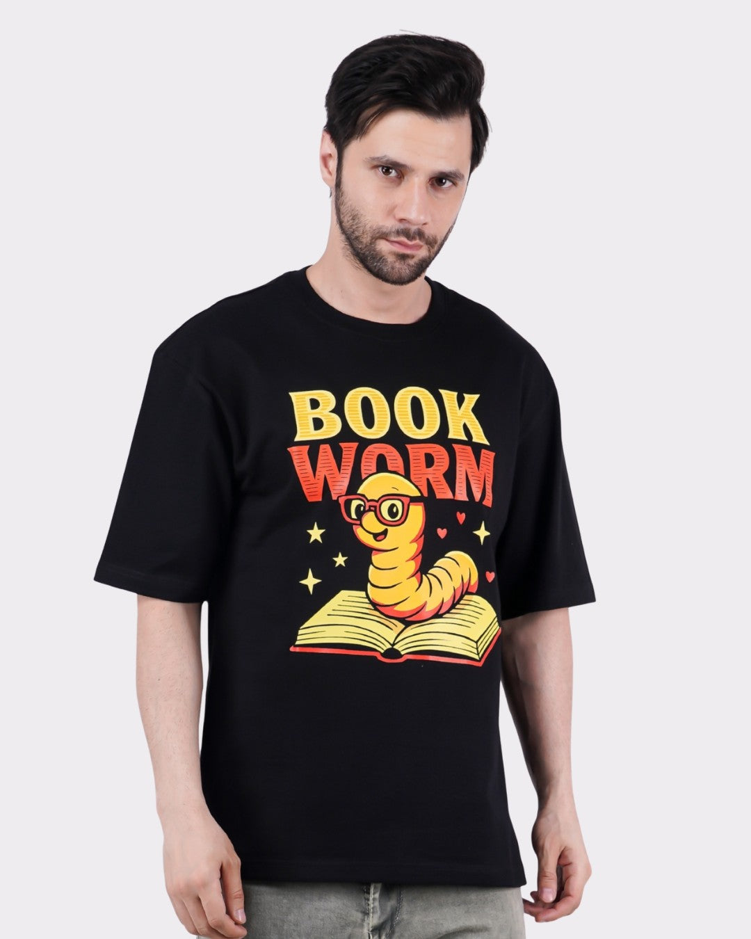 Book Worm Oversized T-Shirt For Men by Bandar Baant Collections with cartoon bookworm graphic on black fabric