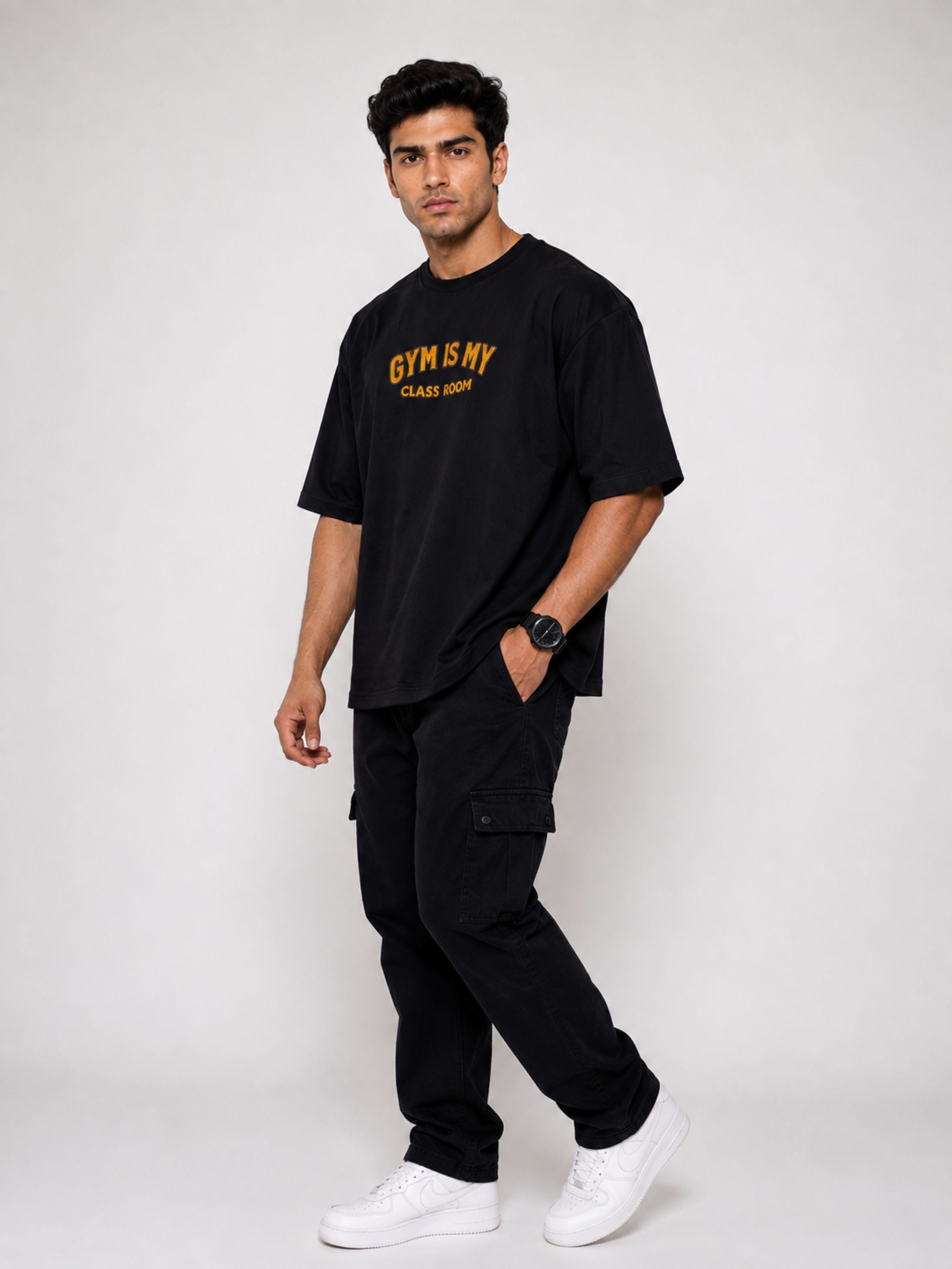 Men's oversized fit black Gym Printed T shirts For Men with orange text styling from Bandar Baant Collections