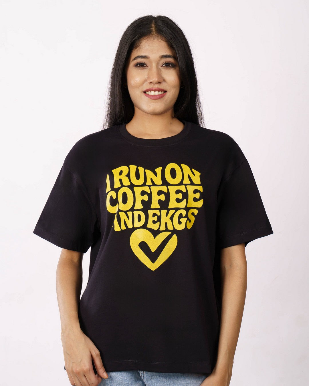 Black oversized fit Cardiologist Trendy Tshirt For Women with yellow graphic text and heart design