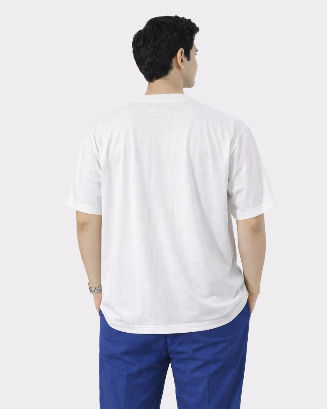 Back view of a man wearing a white oversized fit Chartered Accountant Tshirt For Men from Bandar Baant Collections