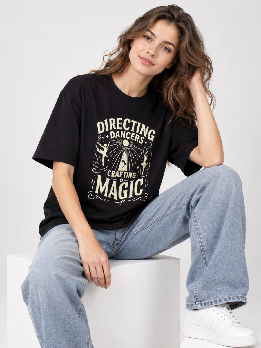 Black oversized fit Choreographer T-shirt For Women with magic dancer print worn with light blue jeans