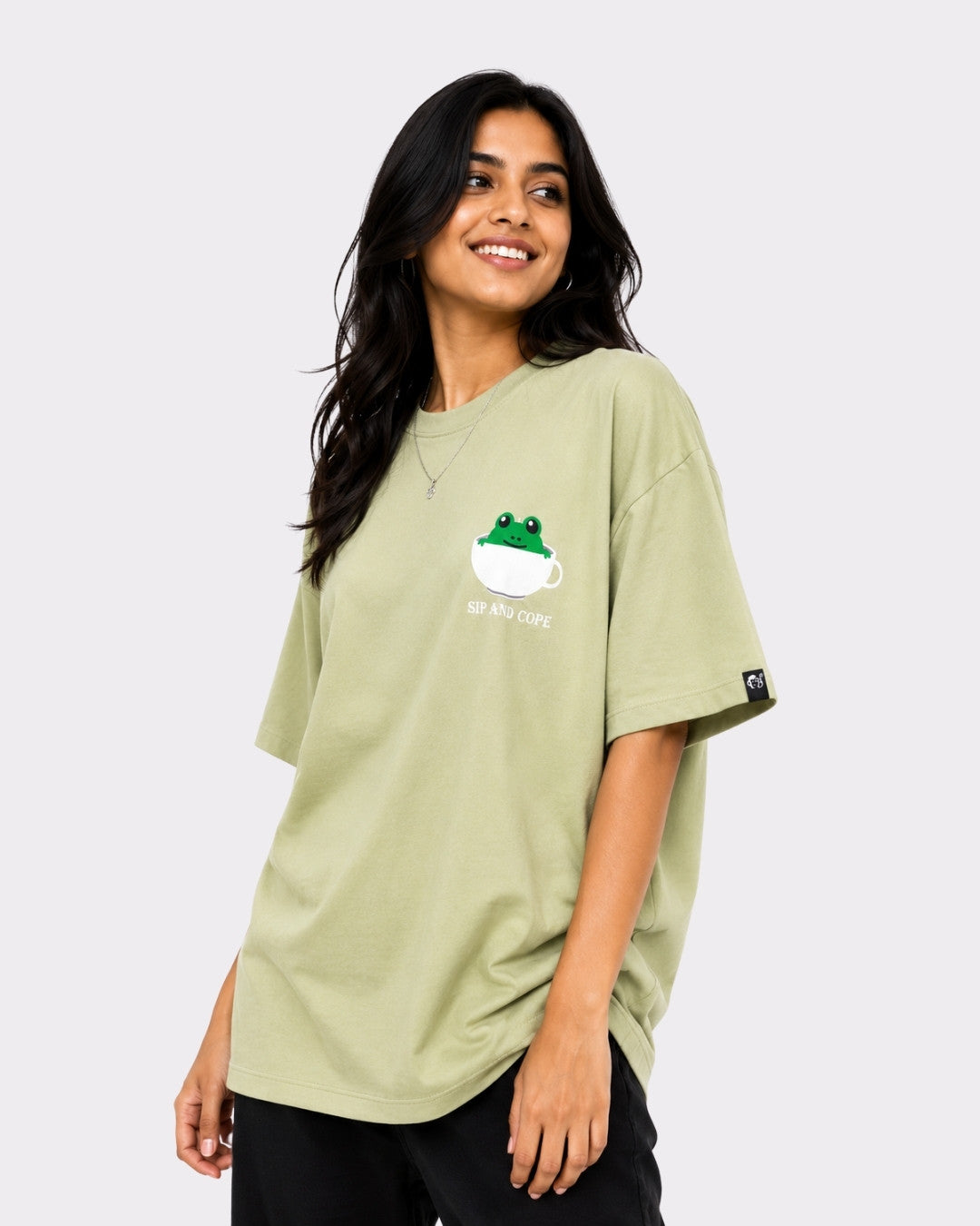 Coffee Lovers Oversized T-Shirt for Women in olive green with frog and coffee cup graphic from Bandar Baant Collections