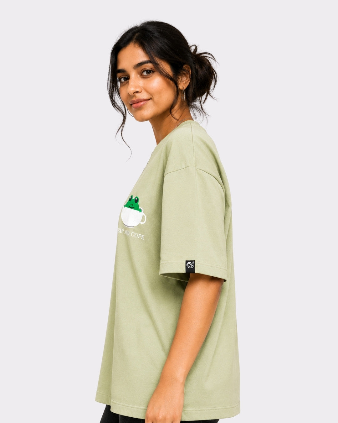 Coffee Lovers Oversized T-Shirt for Women in light green with frog and coffee cup graphic