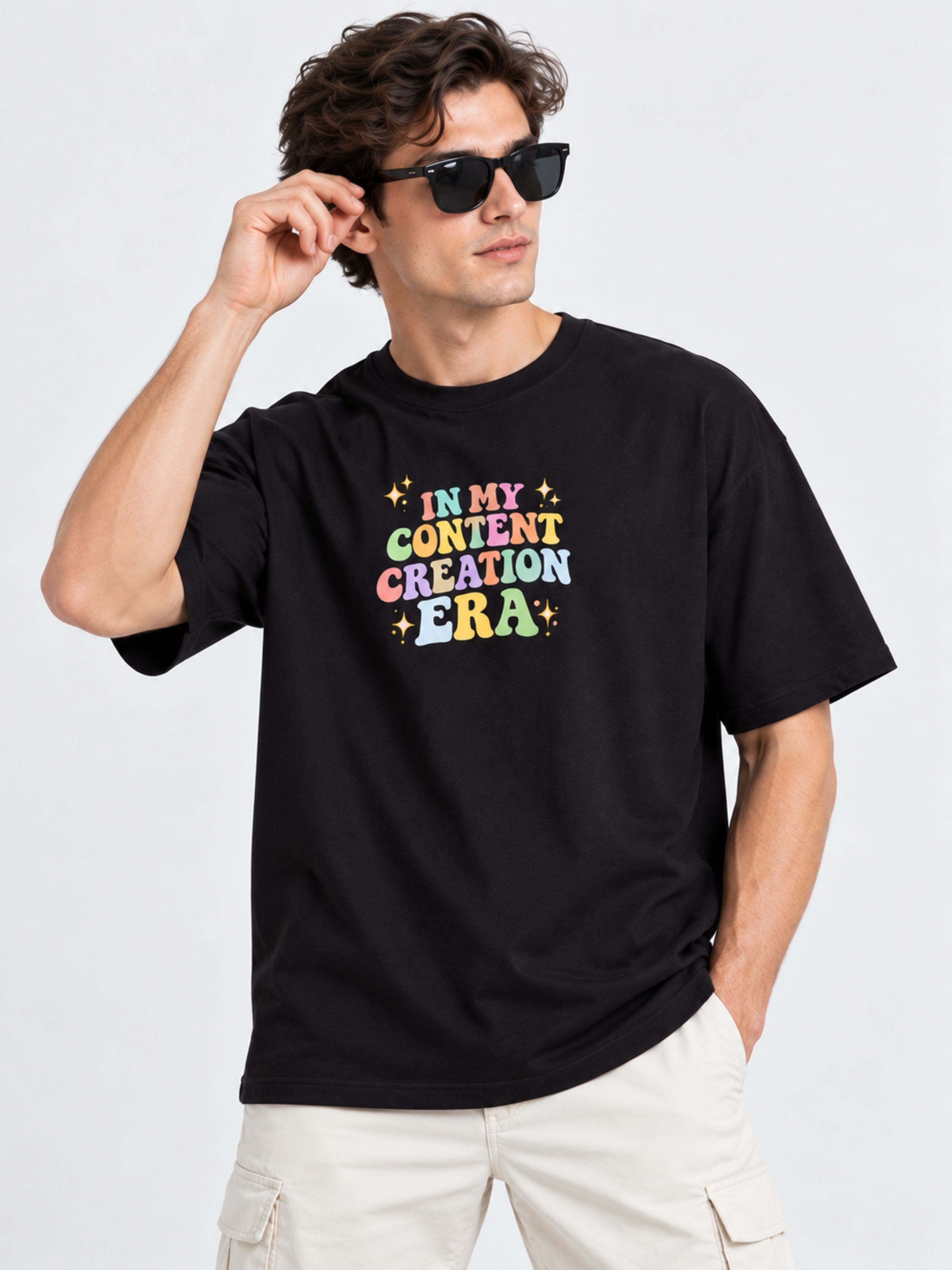 Oversized Content Creators T-Shirt For Men in black with colorful text design worn by model