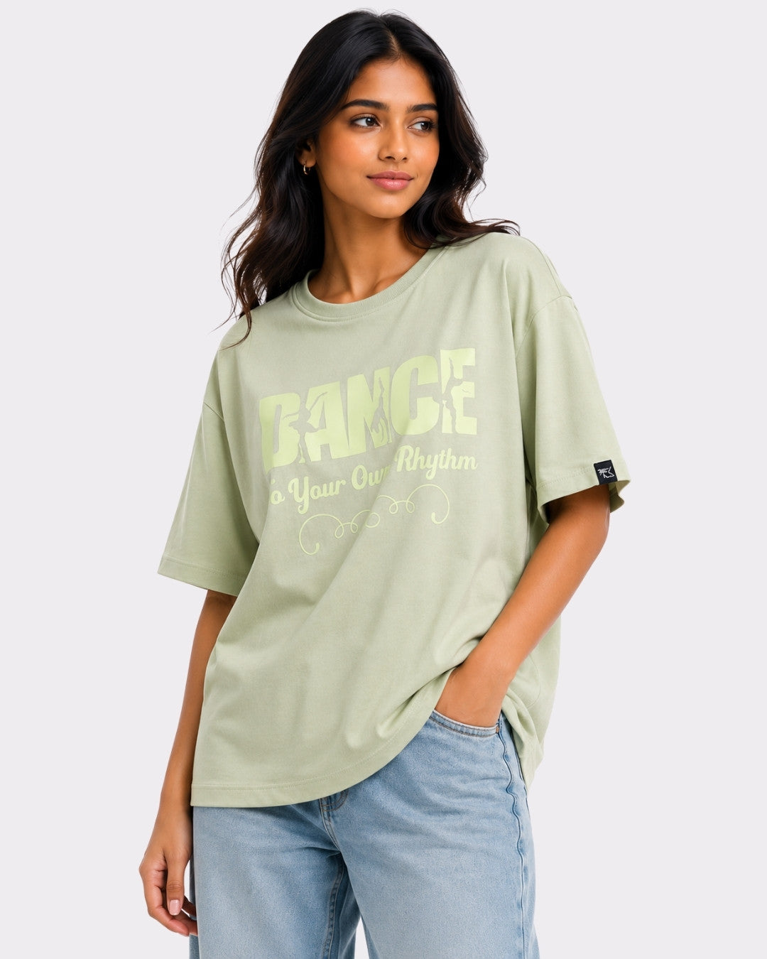Dance to Your Own Rhythm Oversized T-shirt For Women in light green worn by model with casual jeans