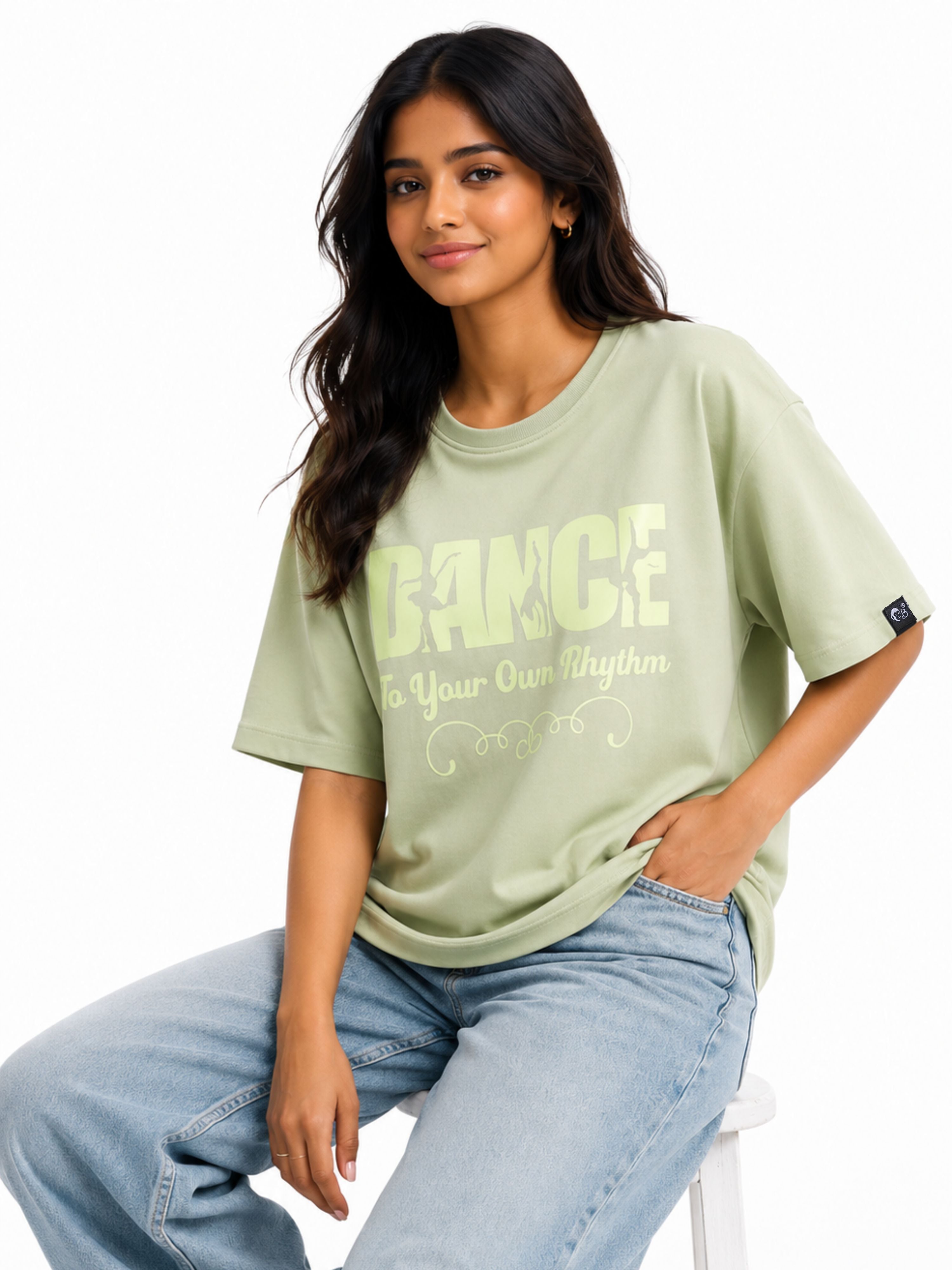 Woman wearing Bandar Baant Collections Dancer Oversized T-shirt For Women in light green with graphic text