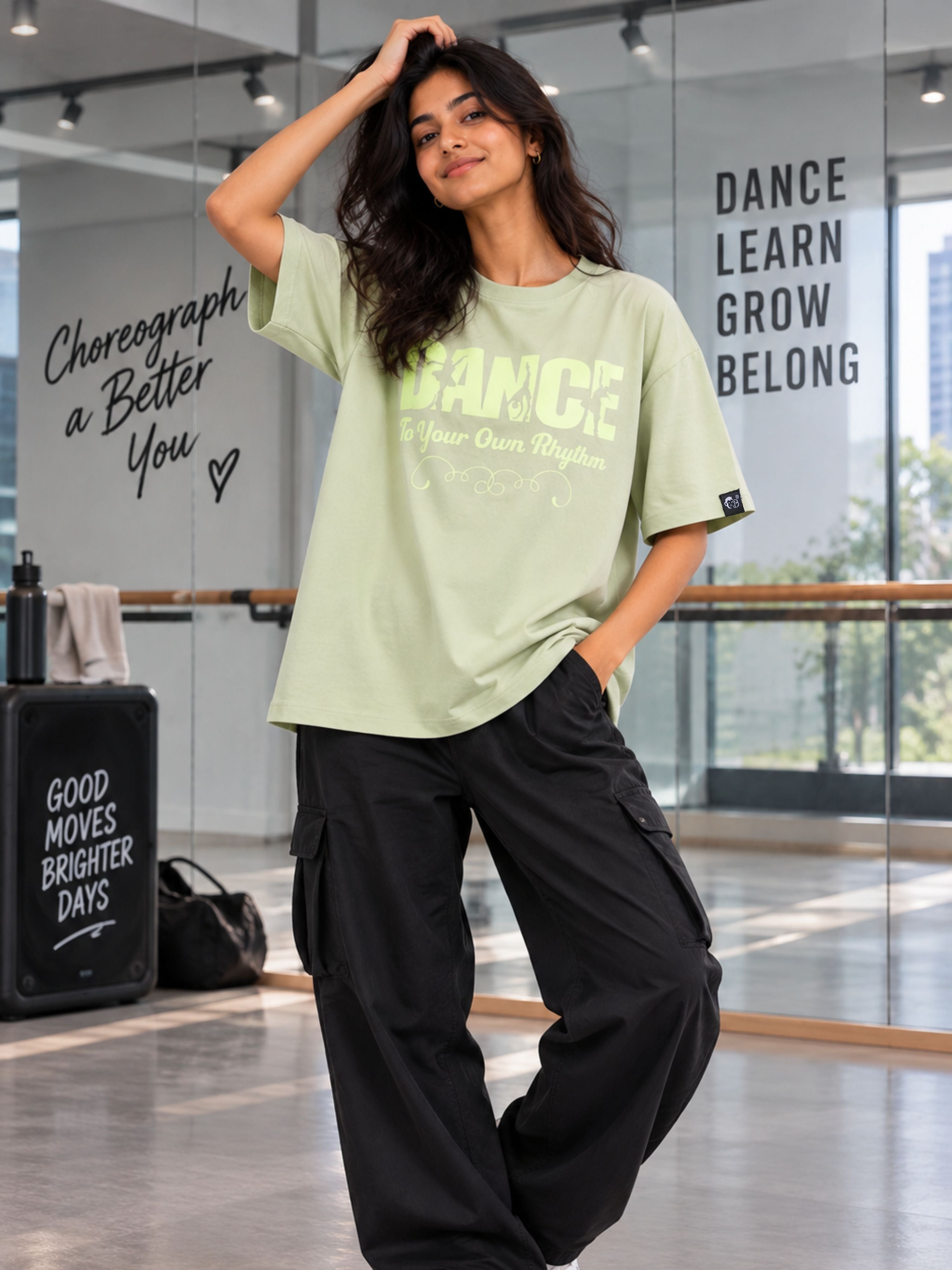 Dancer Oversized T-shirt For Women in light green worn with black cargo pants by Bandar Baant Collections
