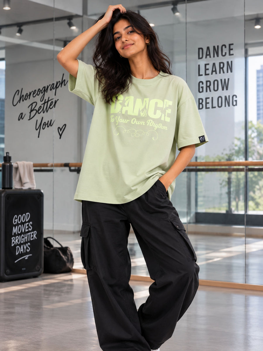 Dancer Oversized T-shirt For Women in light green worn with black cargo pants by Bandar Baant Collections