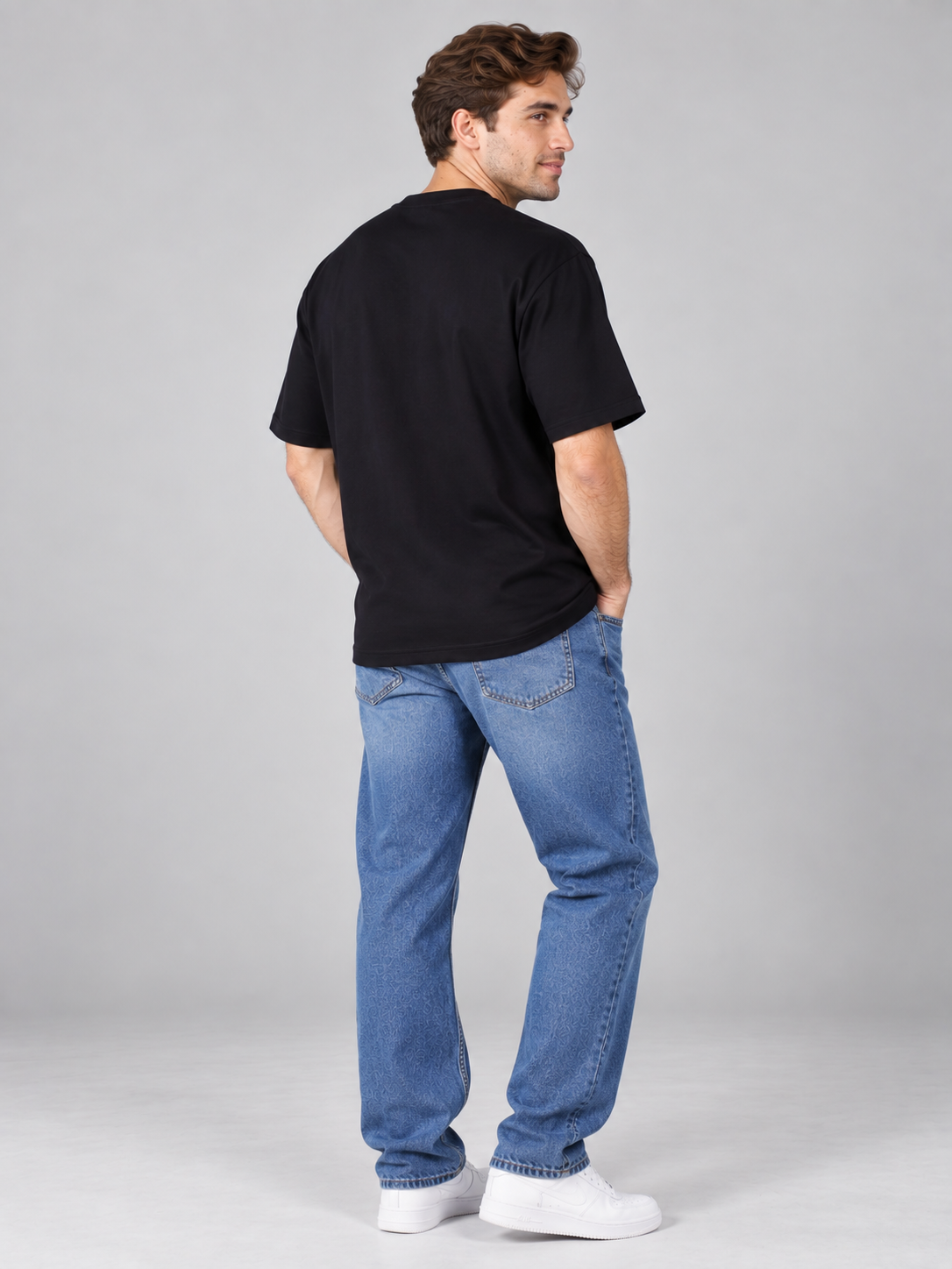 Bandar Baant Collections oversized fit Dancer T-shirt For Men in black worn with blue jeans and white sneakers