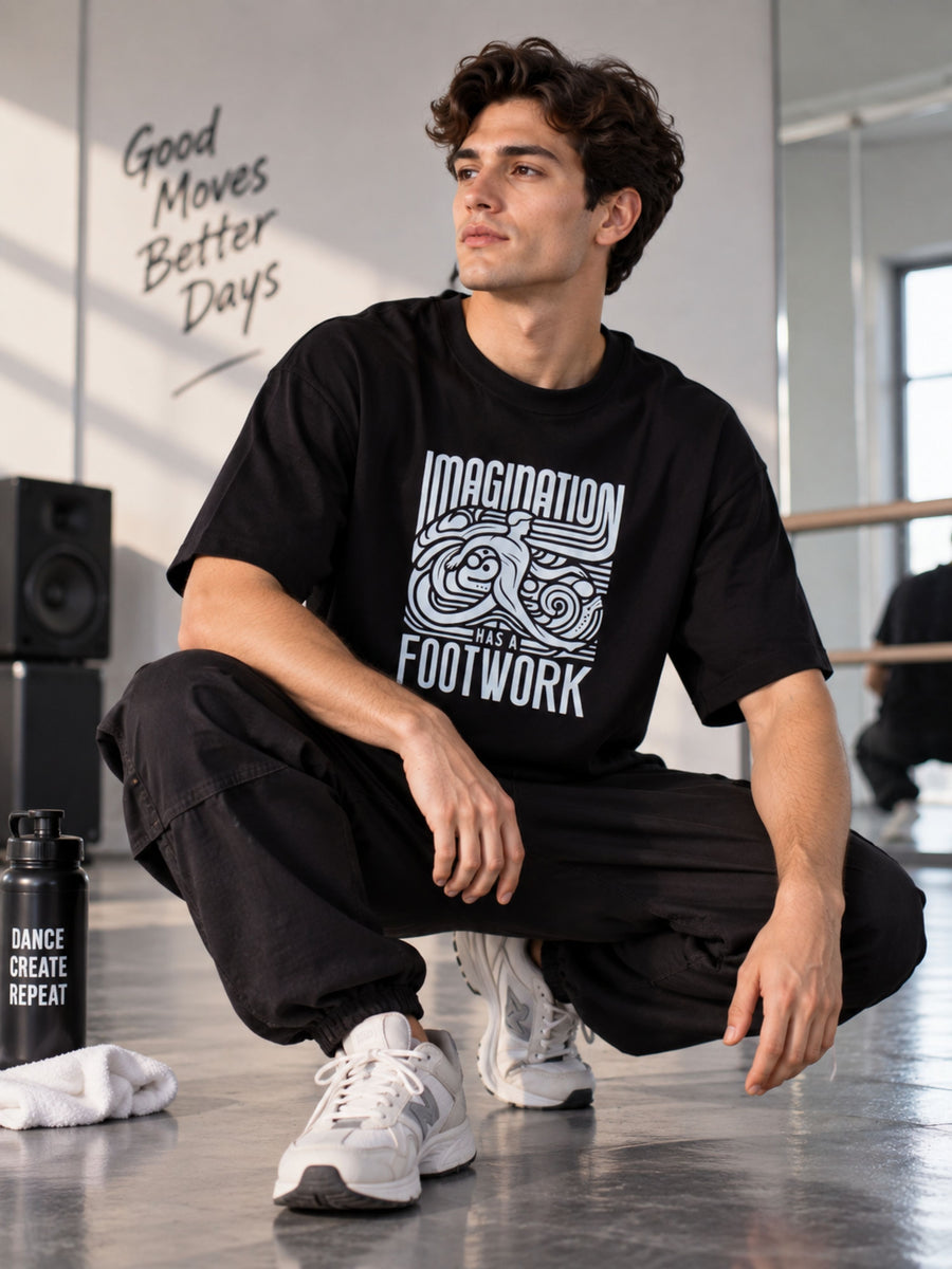 Dancer T-shirt For Men oversized fit in black with creative print worn by male dancer in studio