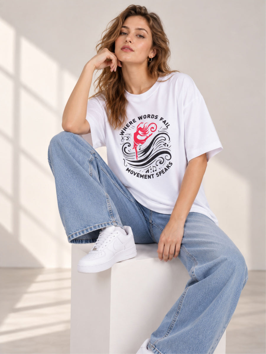 Oversized fit Dancer T-shirt For Women in white with graphic print worn with blue jeans and white sneakers