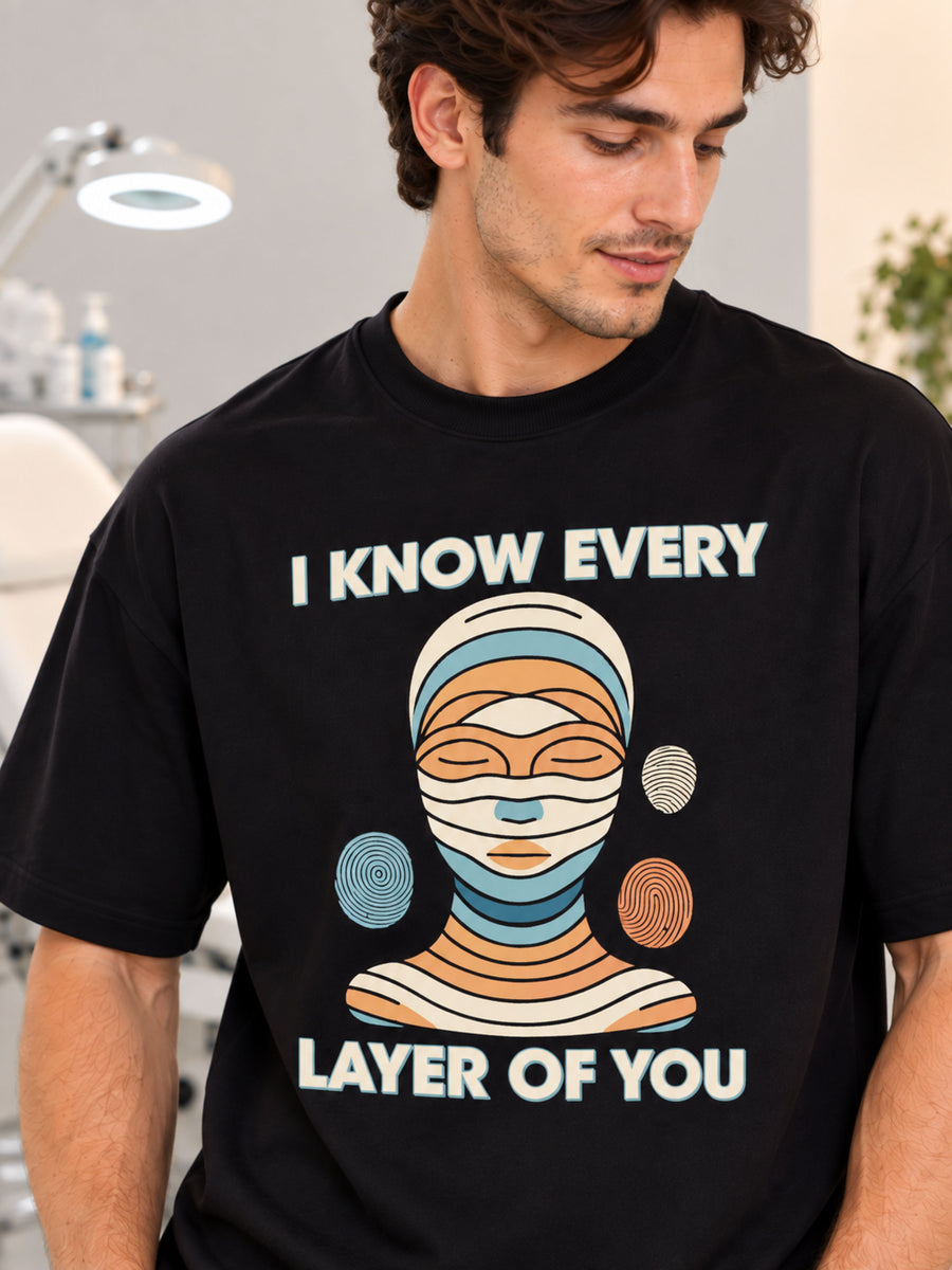 Oversized fit Dermatologist T-shirt for Men in black with colorful layered face graphic and text design