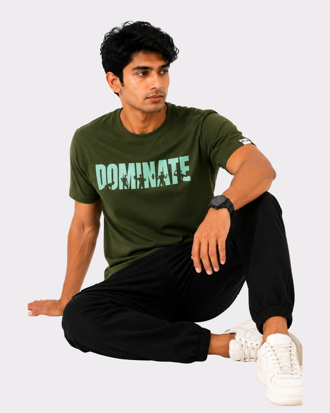 Bandar Baant Collections Dominate T-Shirt For Men in olive green with regular fit worn by seated male model