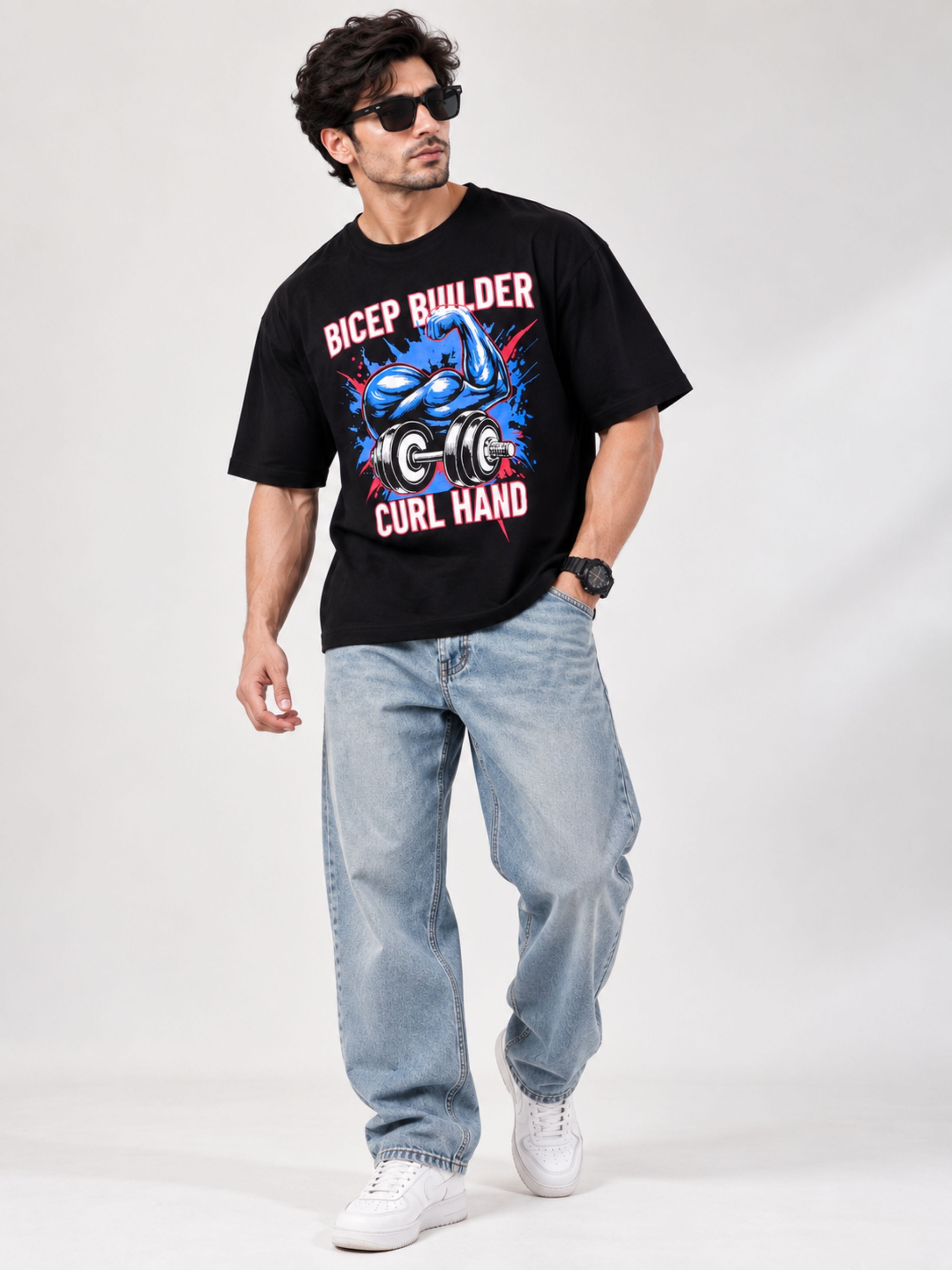 Man wearing oversized fit Gym Enthusiast Graphic T-shirt For Men with bicep builder design
