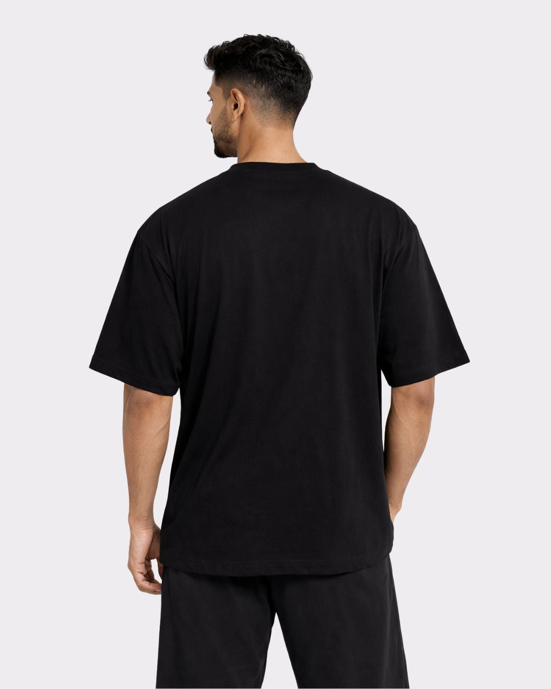 Back view of Gym Enthusiast Oversized Graphic T-shirt For Men in black by Bandar Baant Collections