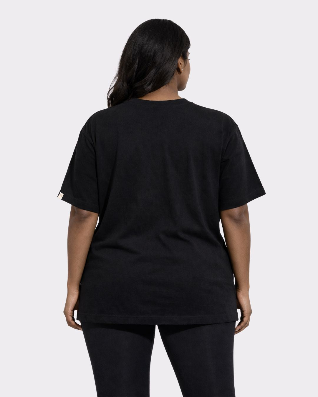 Back view of black Gym Enthusiast Oversized Graphic T-shirt For Women by Bandar Baant Collections