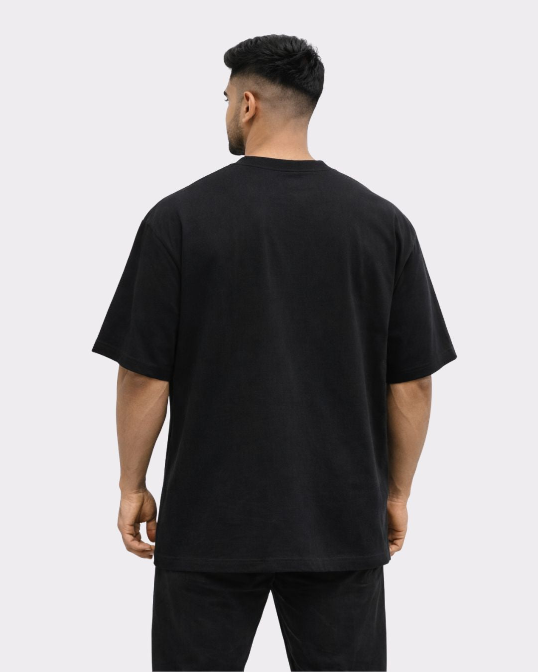 Back view of Gym Enthusiast Oversized Quirky Tshirt For Men in black by Bandar Baant Collections