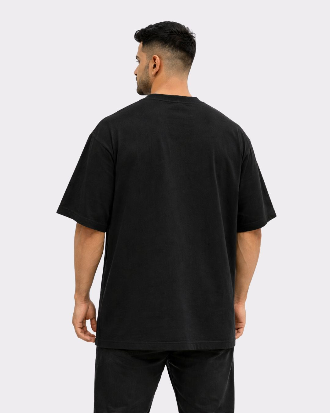 Back view of black Gym Enthusiast Oversized Trendy T-shirt For Men by Bandar Baant Collections worn by male model