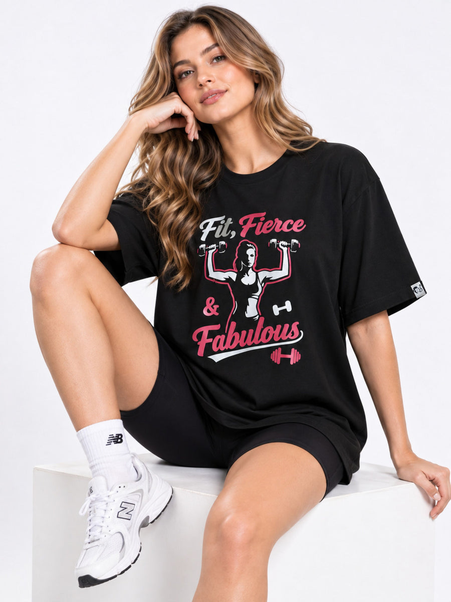 Gym Enthusiast Printed T-shirt For Women oversized fit black T-shirt with fitness graphic worn by a seated woman