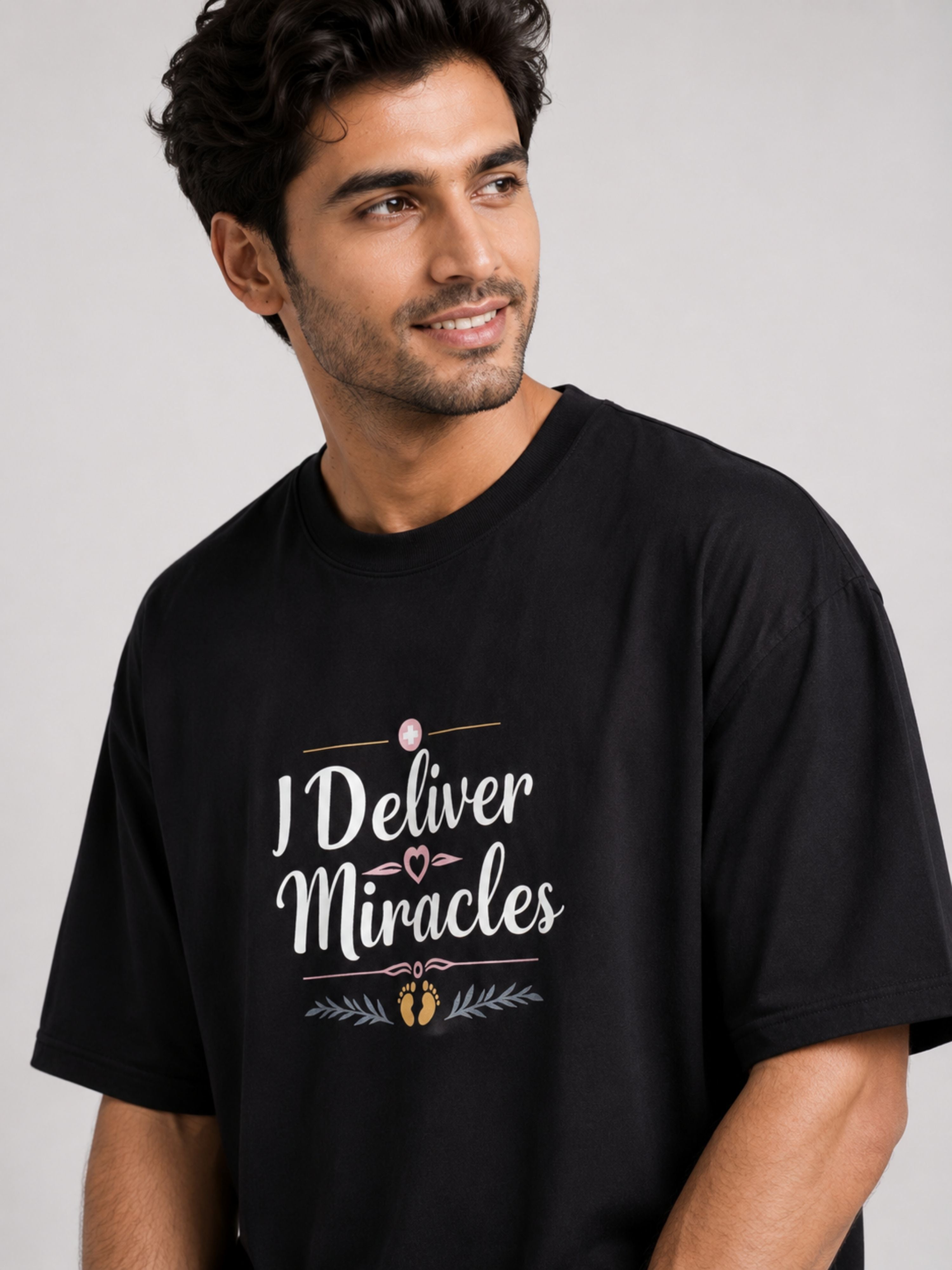 Black oversized fit Tshirt from Bandar Baant Collections with I Deliver Miracles print Gynaecologist Quote Tshirt For Men