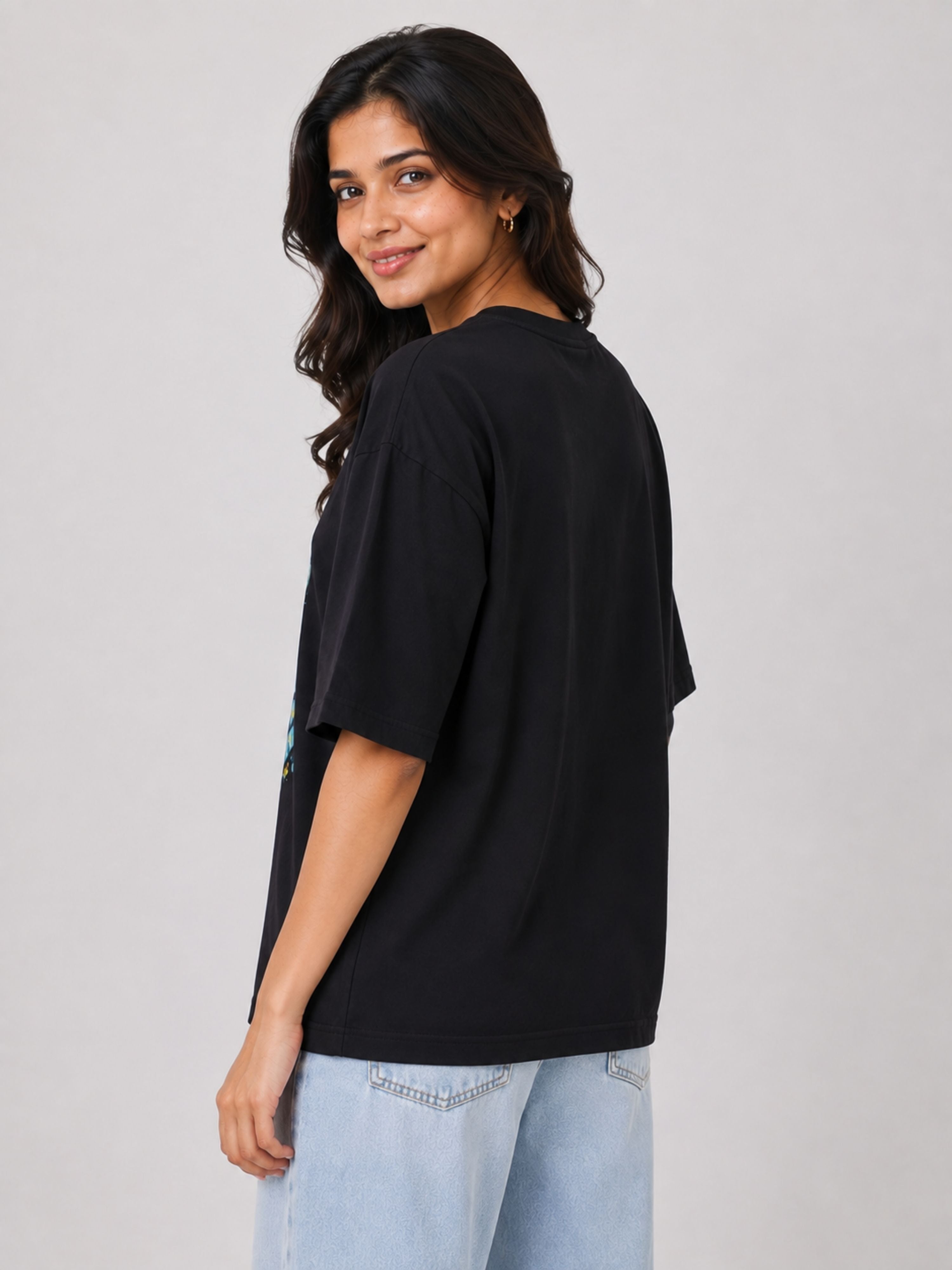 Black oversized fit Gynaecologist T shirt For Women from Bandar Baant Collections worn with light blue jeans