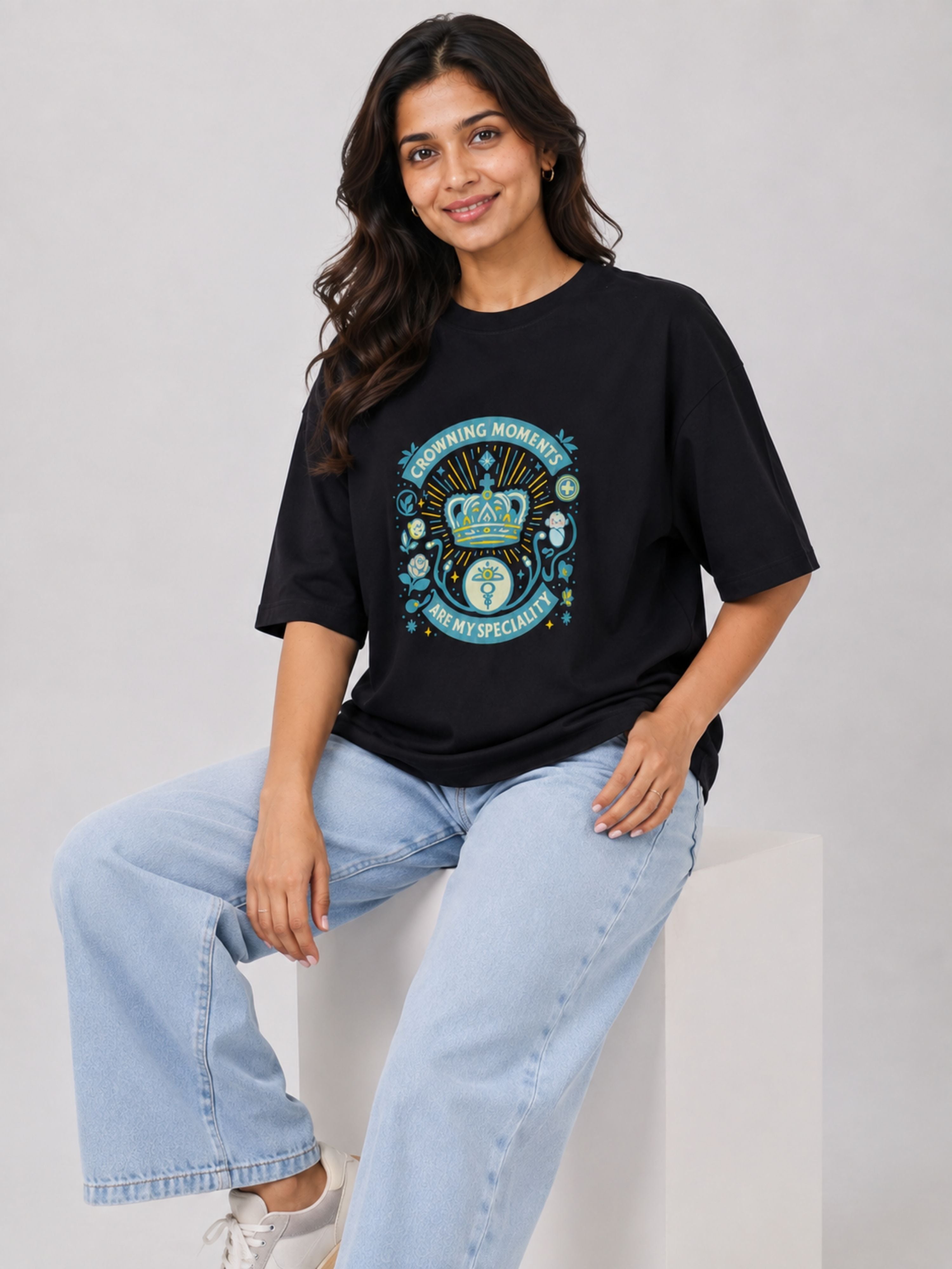Black oversized fit Gynaecologist T shirt For Women with colorful medical graphic worn by smiling woman