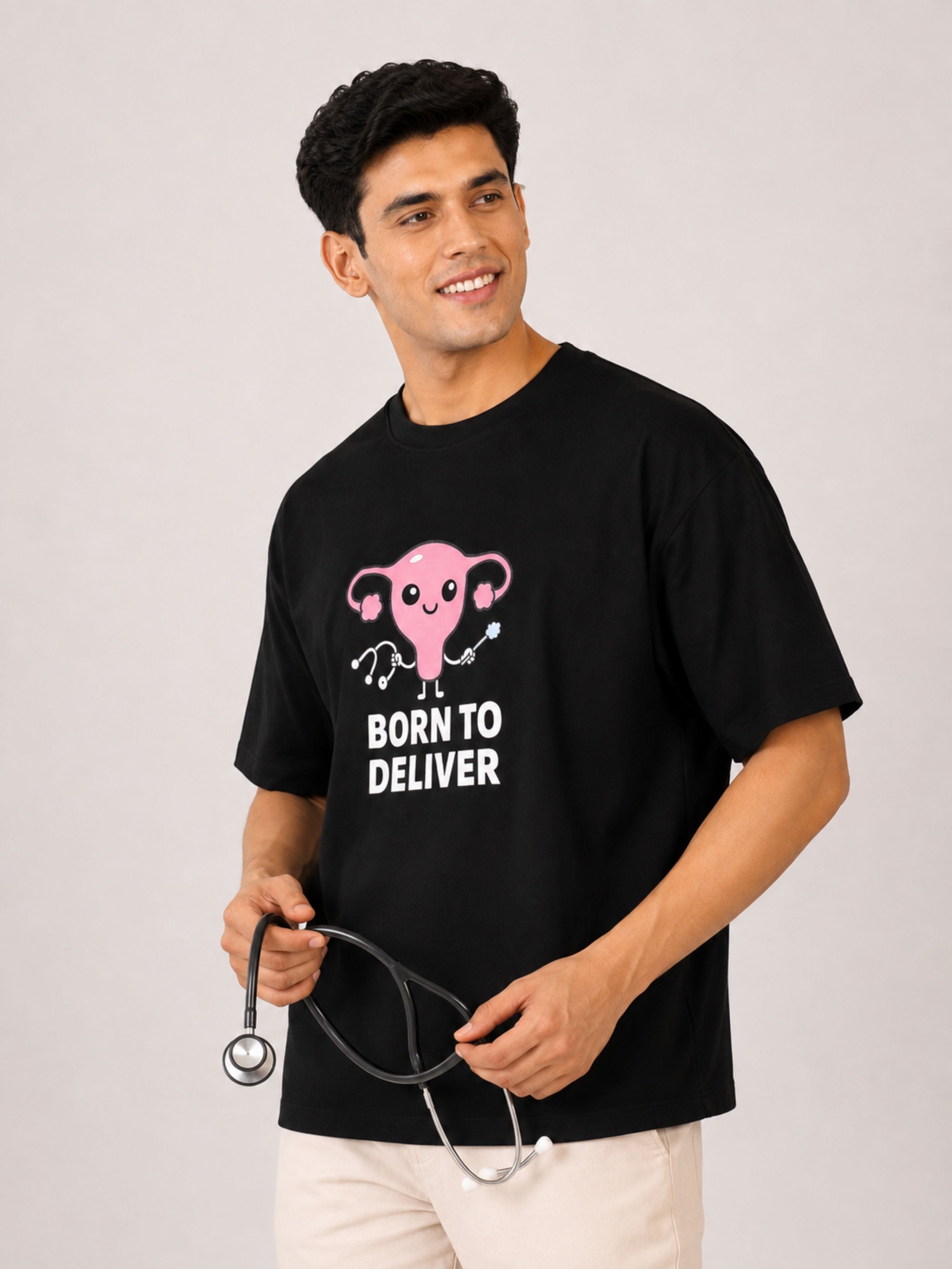 Oversized fit Gynaecologist Trendy Graphic Tshirt For Men in black with pink uterus design and Born to Deliver text