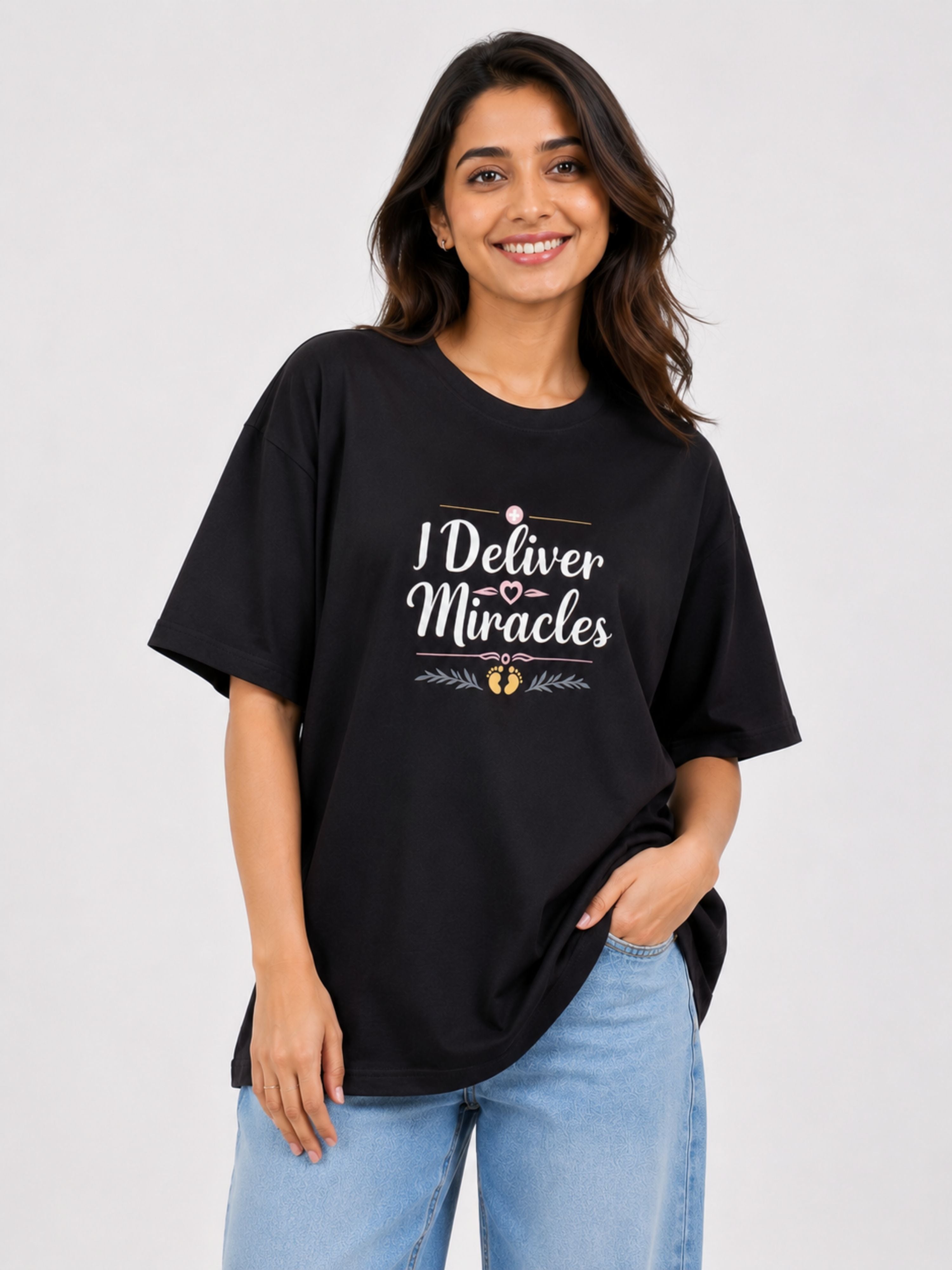 Woman wearing oversized fit black Gynaecologist Trendy T-shirt For Women with I Deliver Miracles print