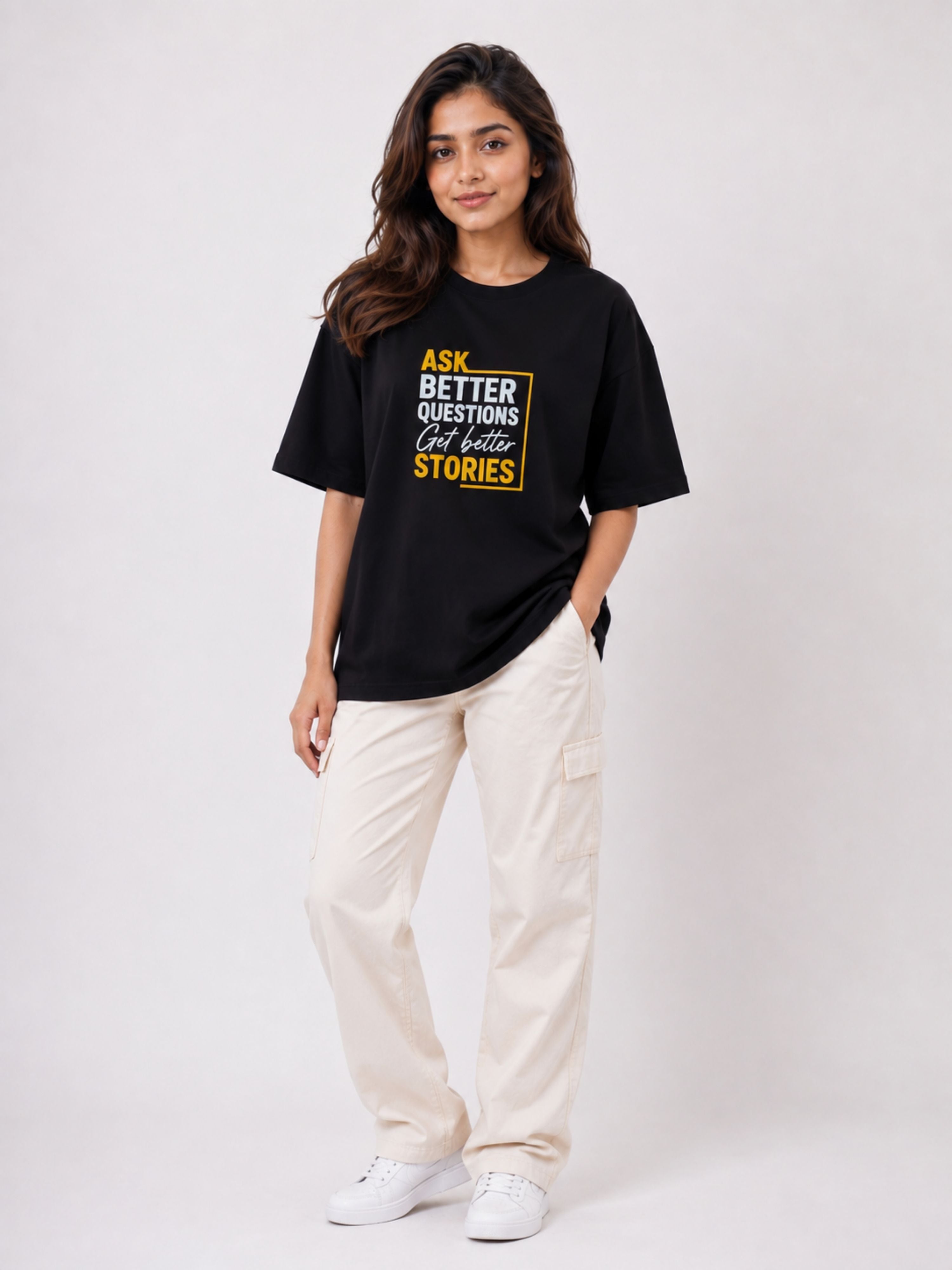 Black oversized fit Journalists Quote T-shirt For Women with yellow text worn by a woman