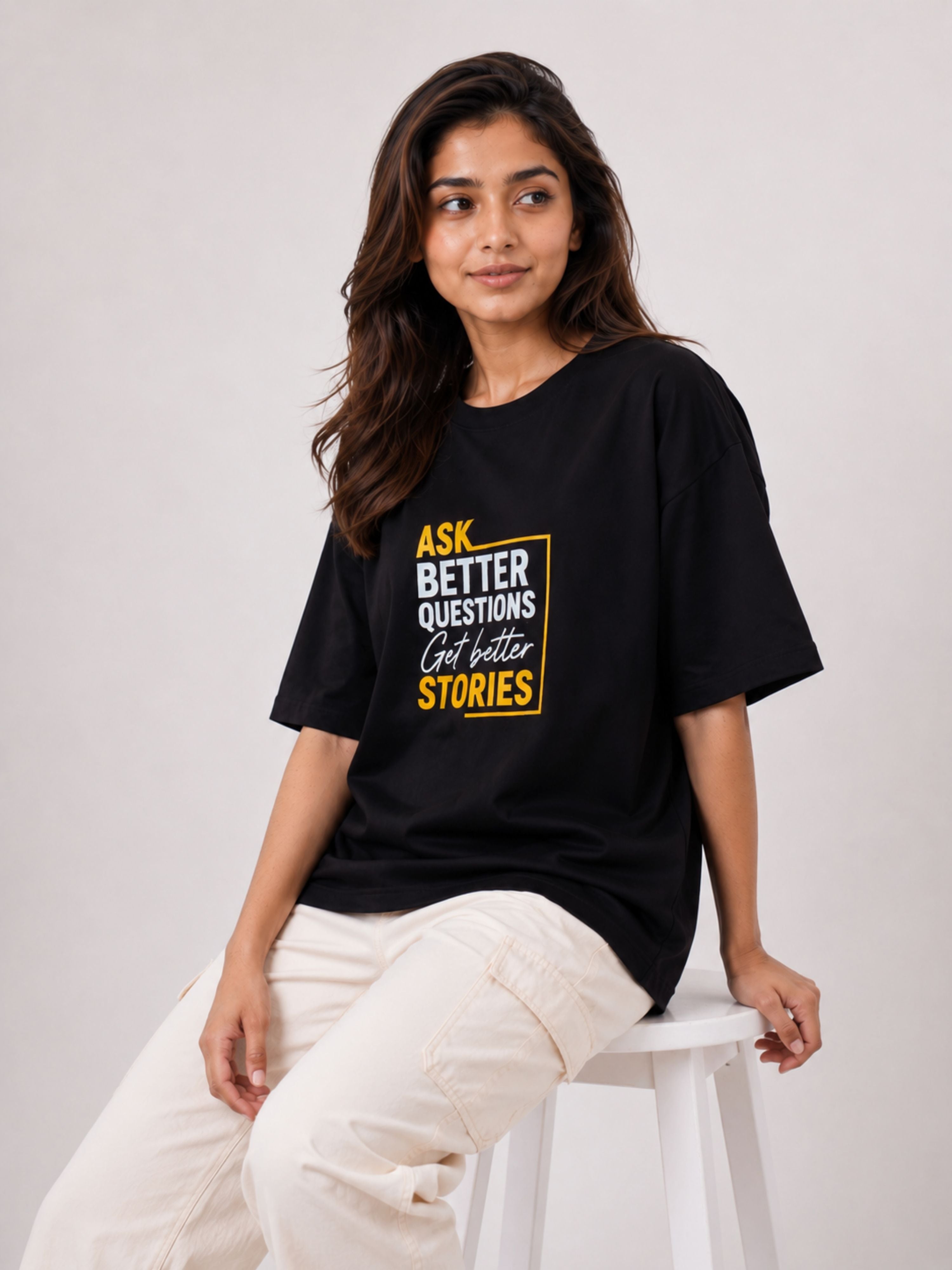 Oversized fit Journalists Quote T-shirt For Women in black with motivational text print worn by model