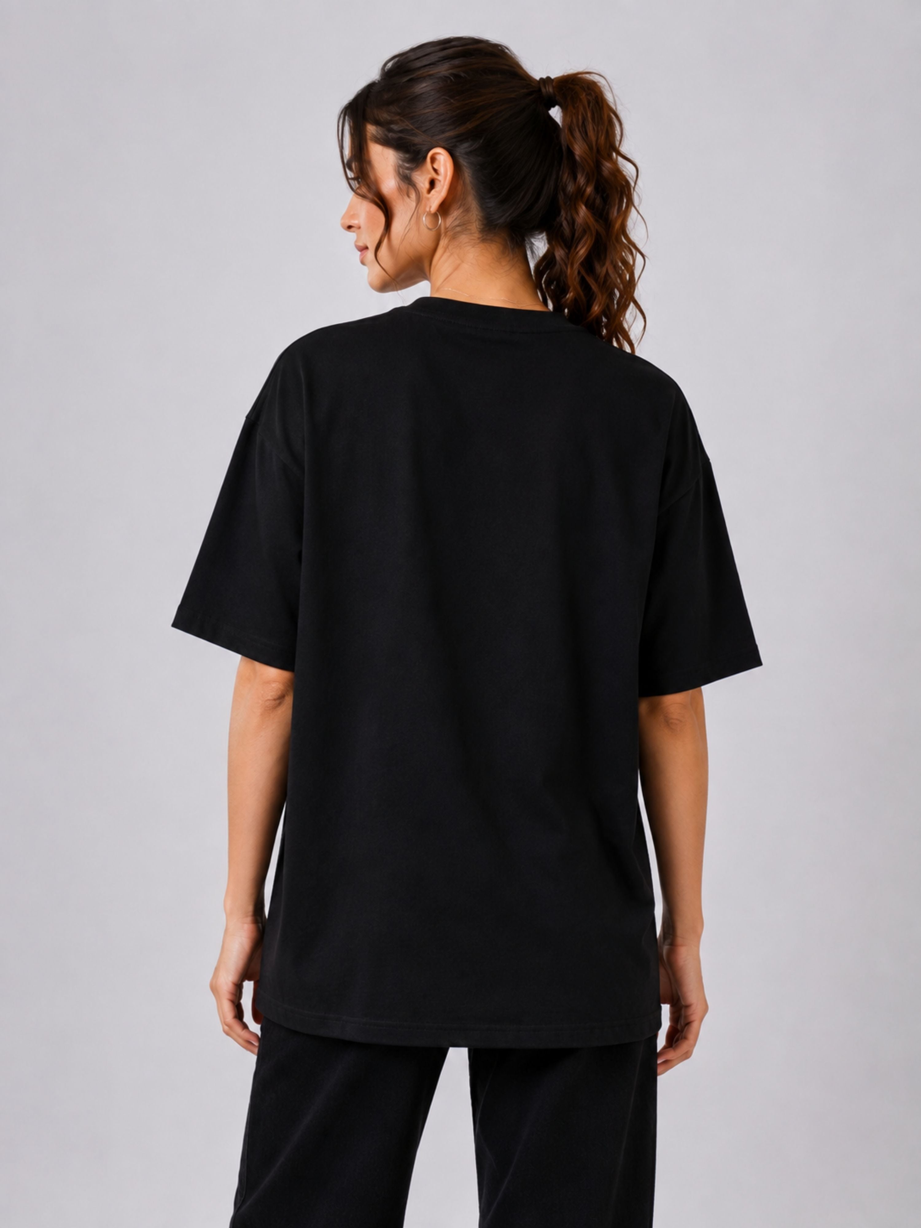 Back view of oversized fit black Journalists Quote Tshirt For Women by Bandar Baant Collections