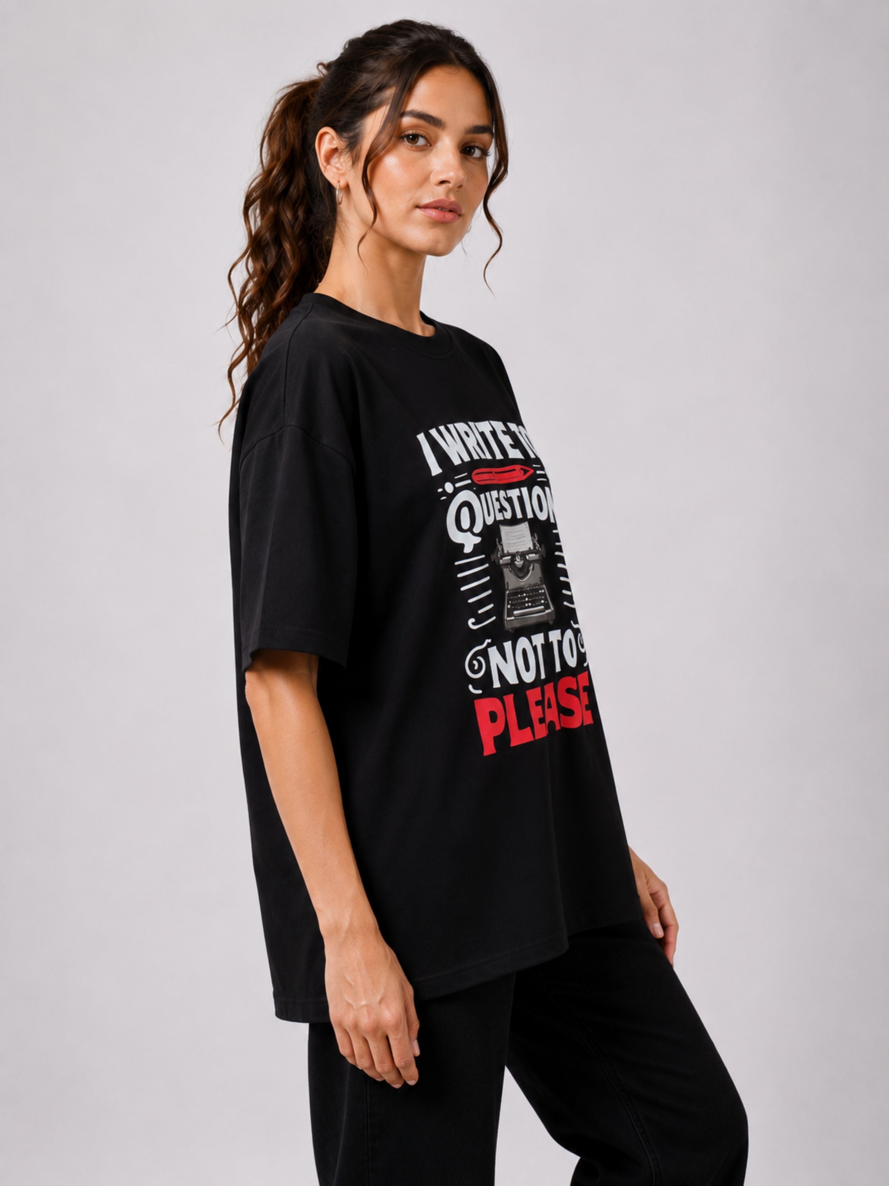 Oversized fit black Journalists Quote Tshirt For Women with bold white and red text worn by model