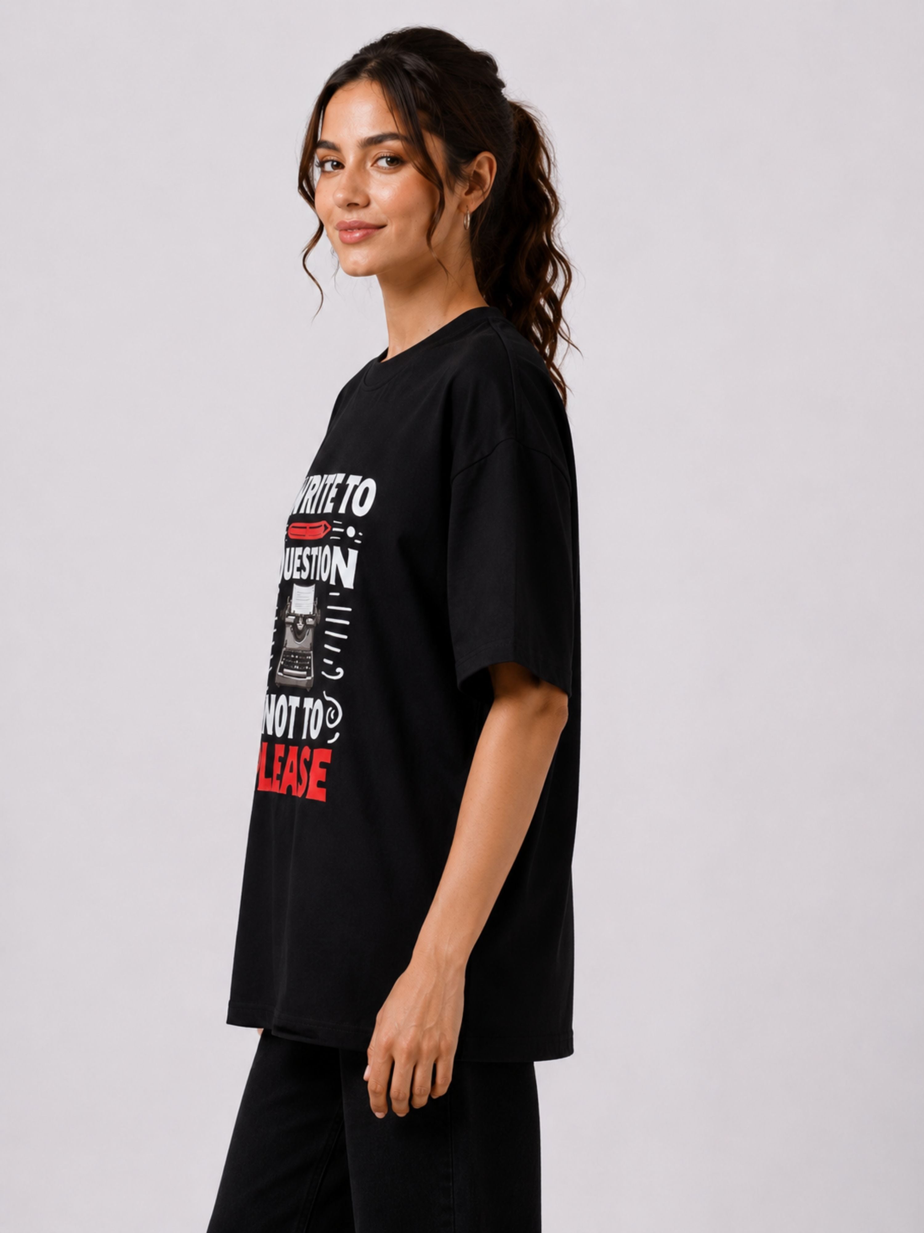 Black oversized fit Journalists Quote Tshirt For Women with printed typewriter design worn by model