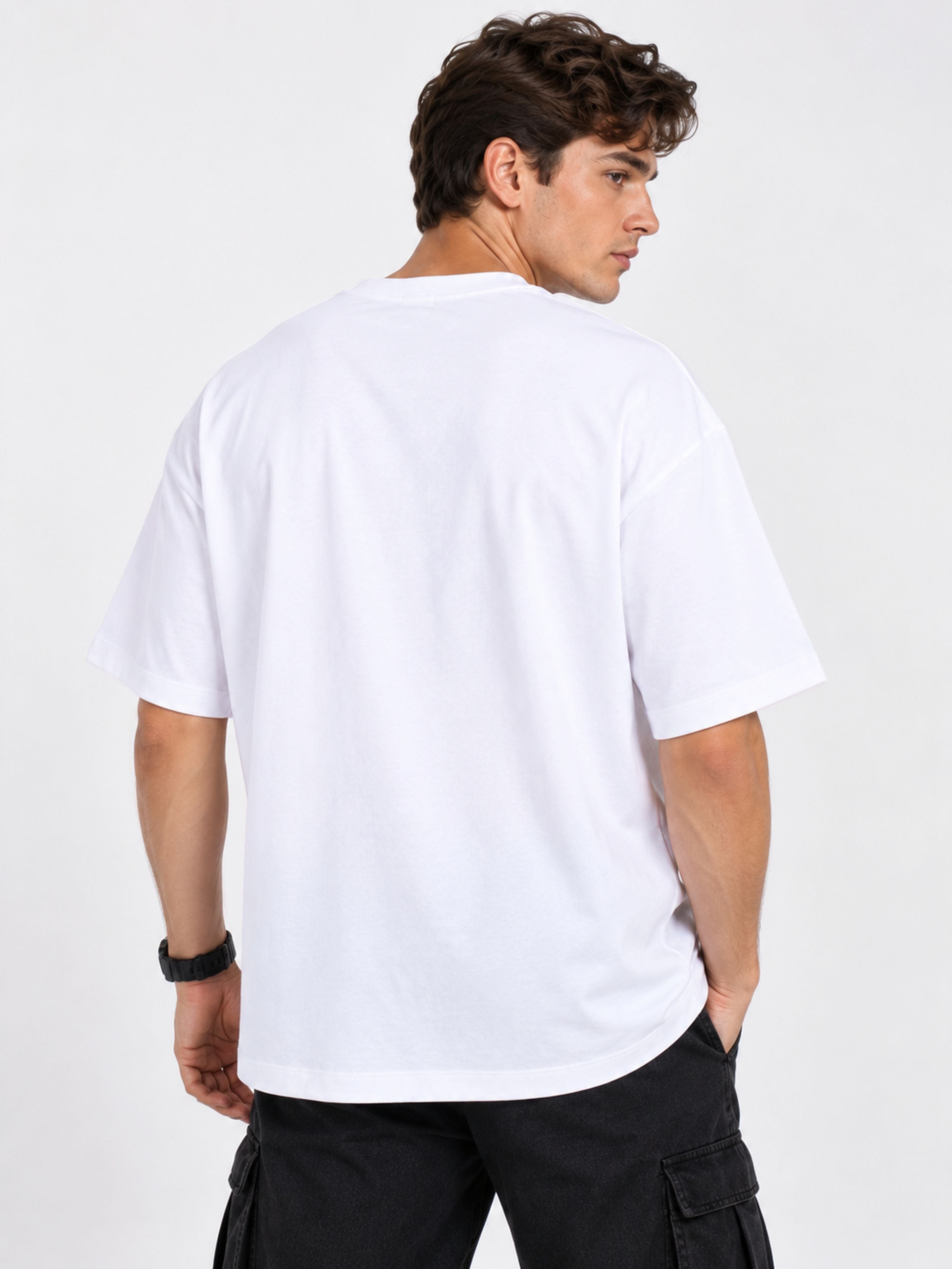 Back view of a man wearing a white oversized fit Journalists T-Shirt For Men by Bandar Baant Collections