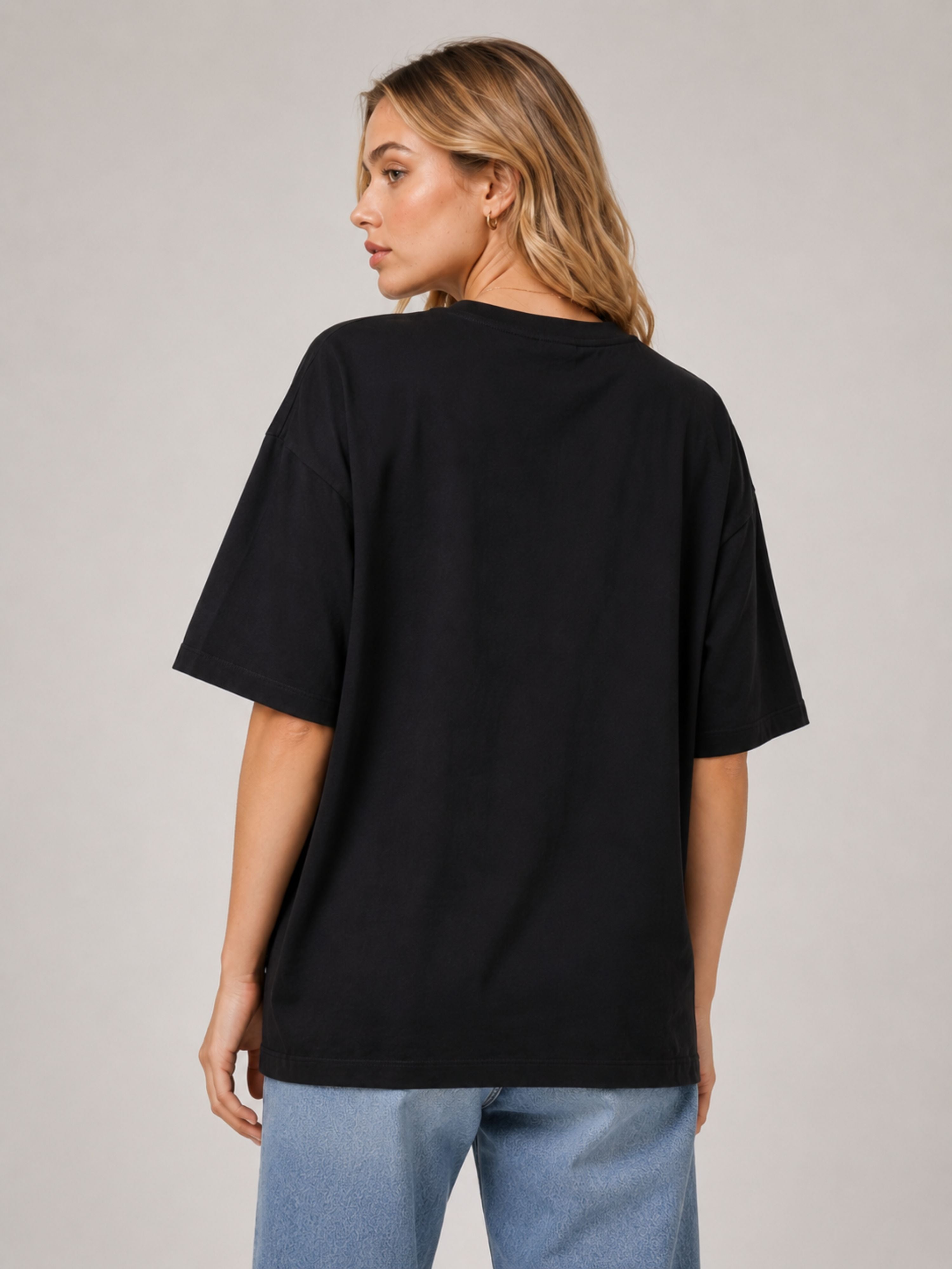 Back view of oversized fit black Journalists T-Shirt For Women by Bandar Baant Collections
