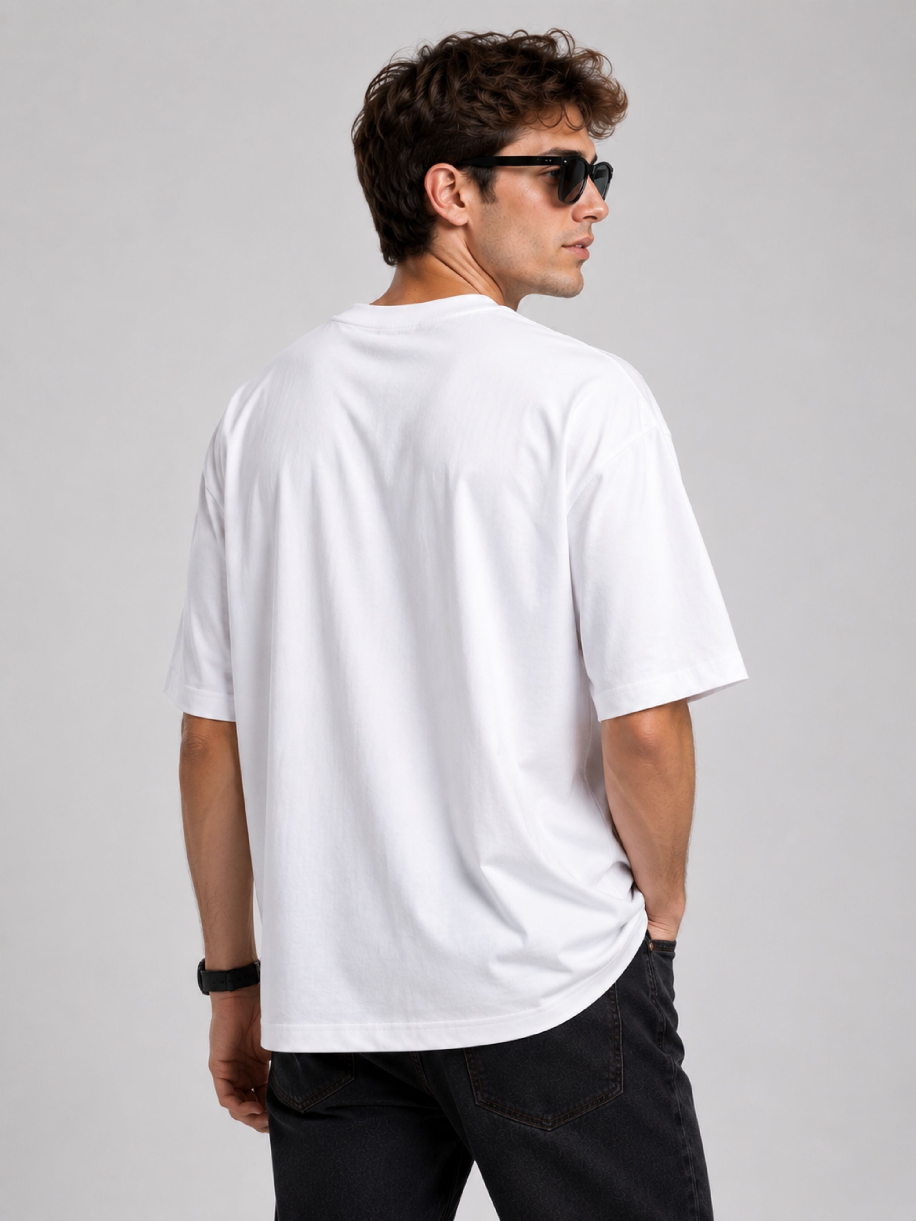 Back view of man wearing oversized fit white Journalists Tshirt For Men from Bandar Baant Collections