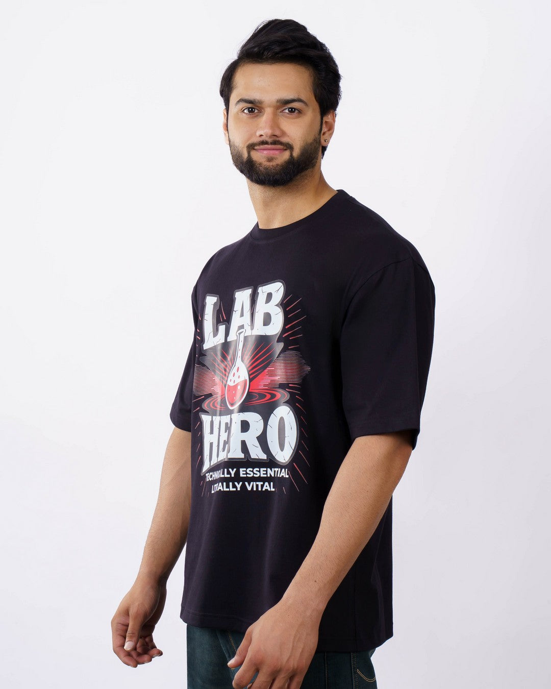 Man wearing oversized fit Lab Technician Quote Tshirt For Men in black with graphic print