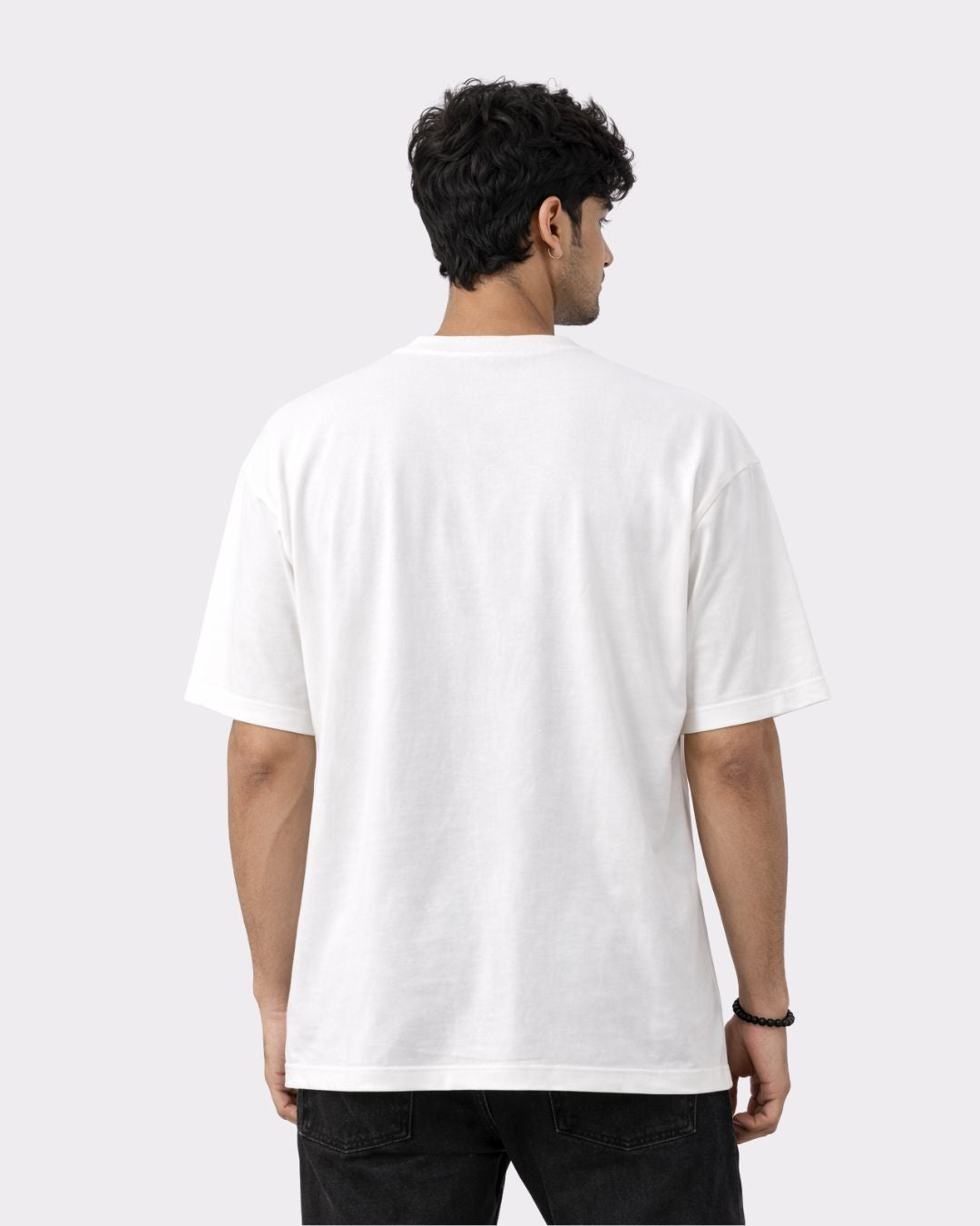 Back view of man wearing a white Lawyer Oversized Quirky T-Shirt For Men from Bandar Baant Collections