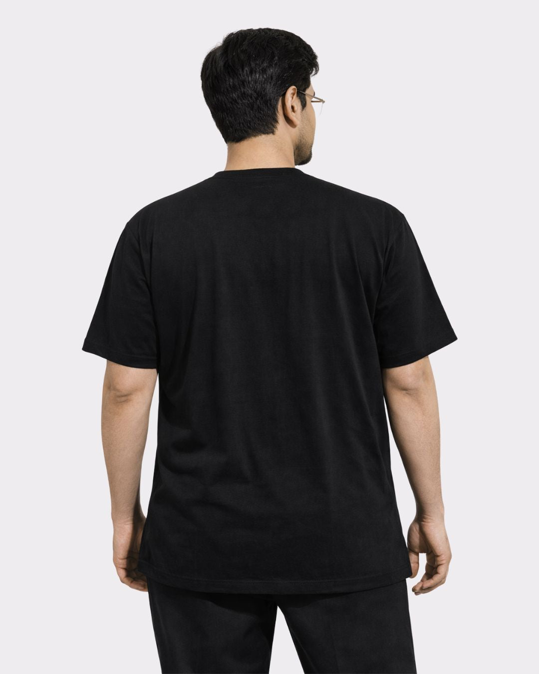 Back view of man wearing black Lawyer Oversized T-Shirt For Men from Bandar Baant Collections