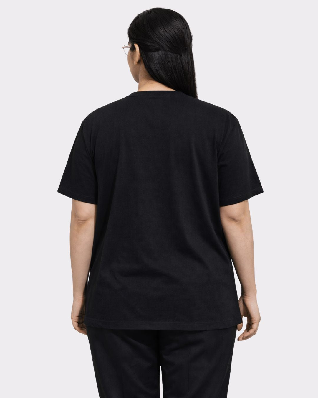 Back view of a woman wearing black Lawyer Oversized T-Shirt For Women by Bandar Baant Collections