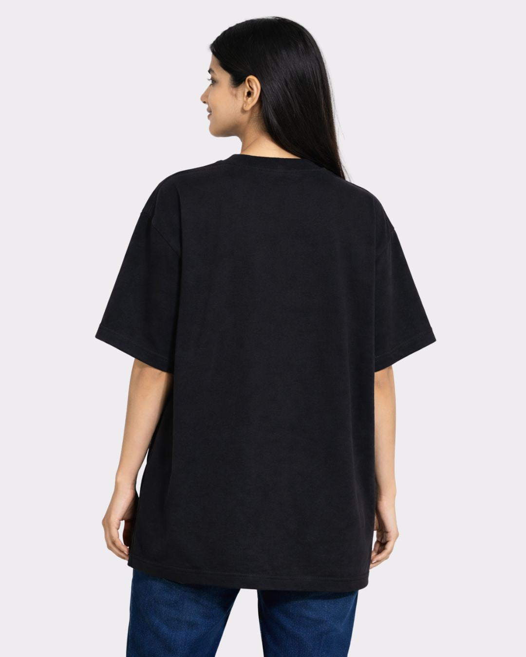 Back view of a woman wearing a black Lawyer Oversized Trendy T-Shirt For Women by Bandar Baant Collections