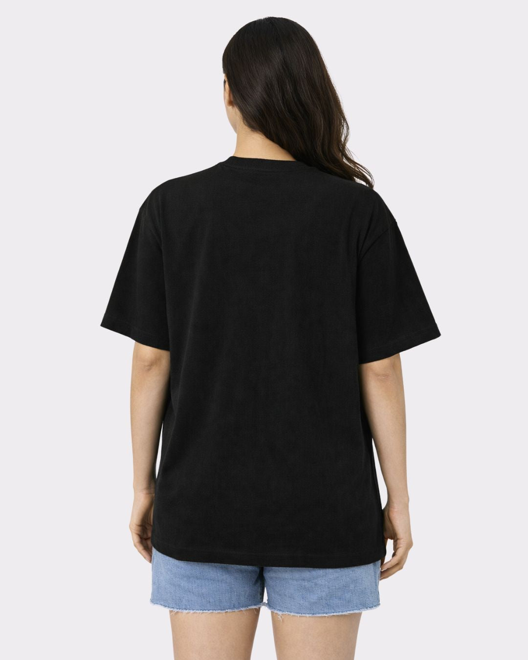Back view of a woman wearing a black Lawyer Oversized Trendy T-Shirt For Women from Bandar Baant Collections