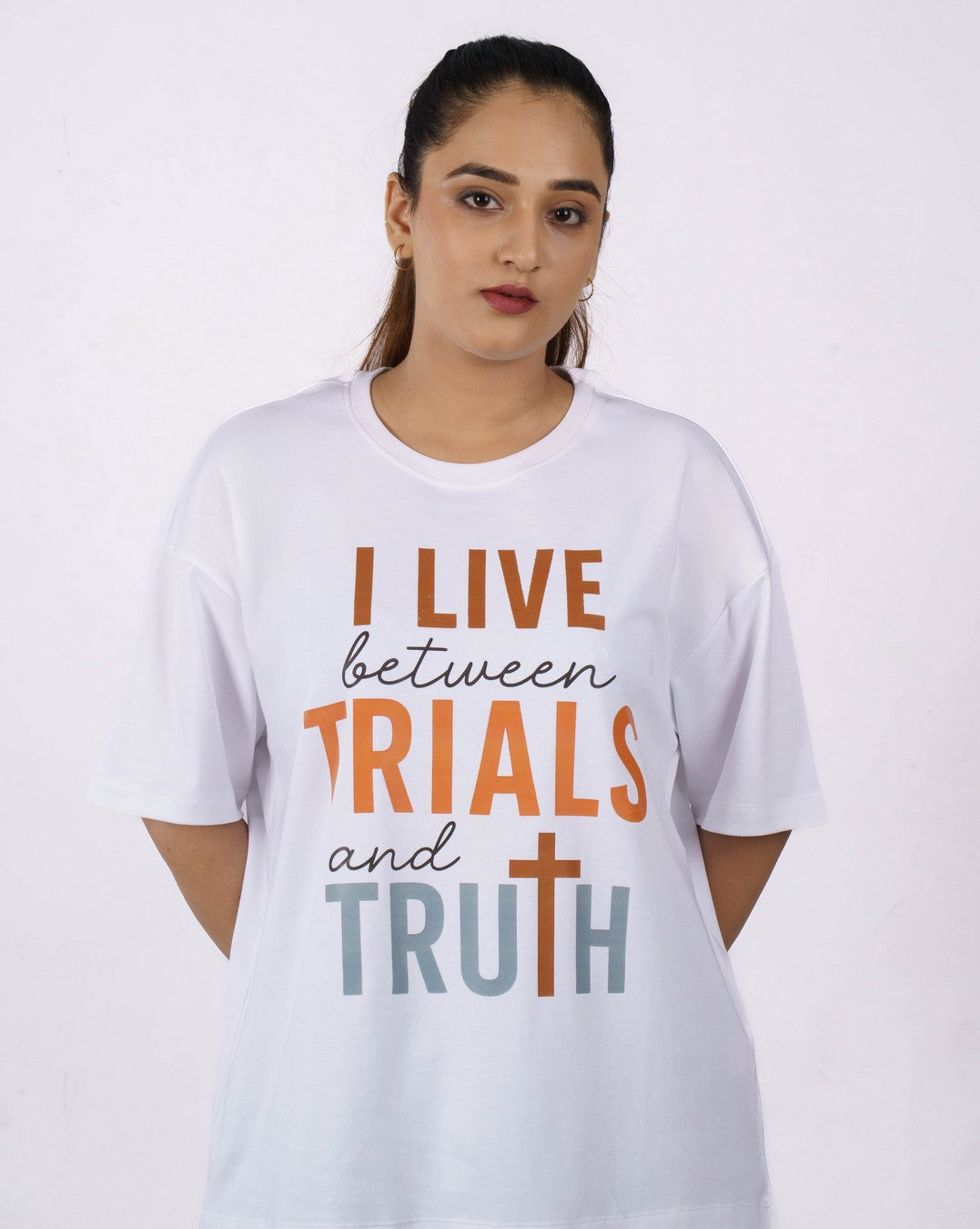 Oversized fit Medical Researcher Tshirt For Women in white with slogan I live between trials and truth